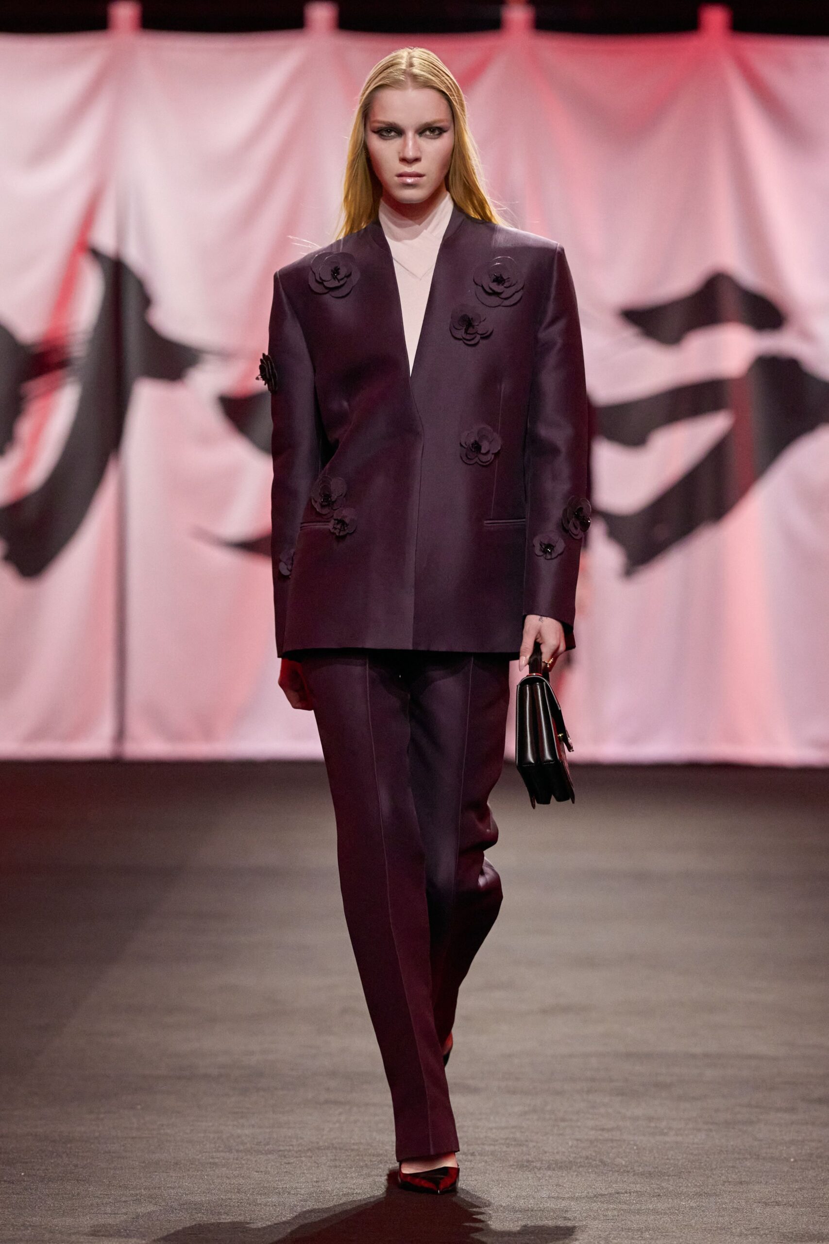 purple tailored suit with red shoes