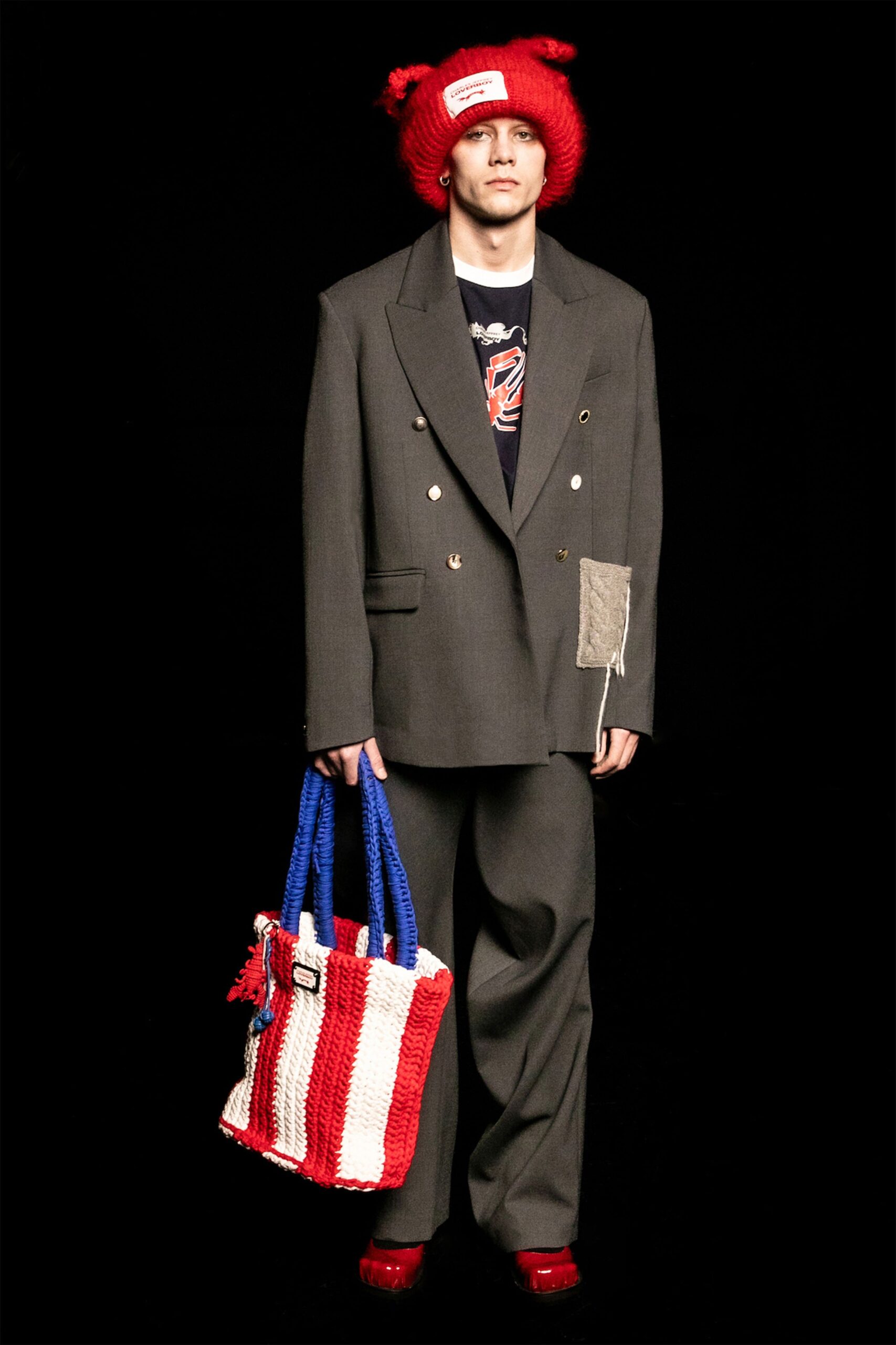 gray tailored blazer with red accessories