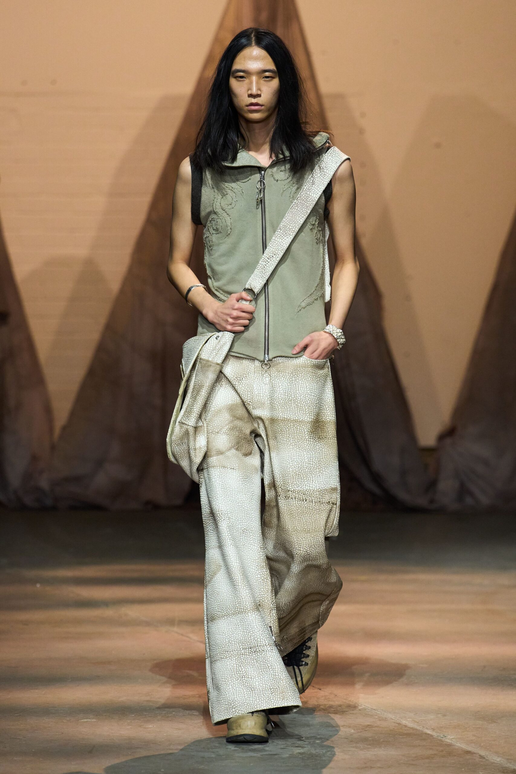 gray sleeveless top with beige wide-leg pants