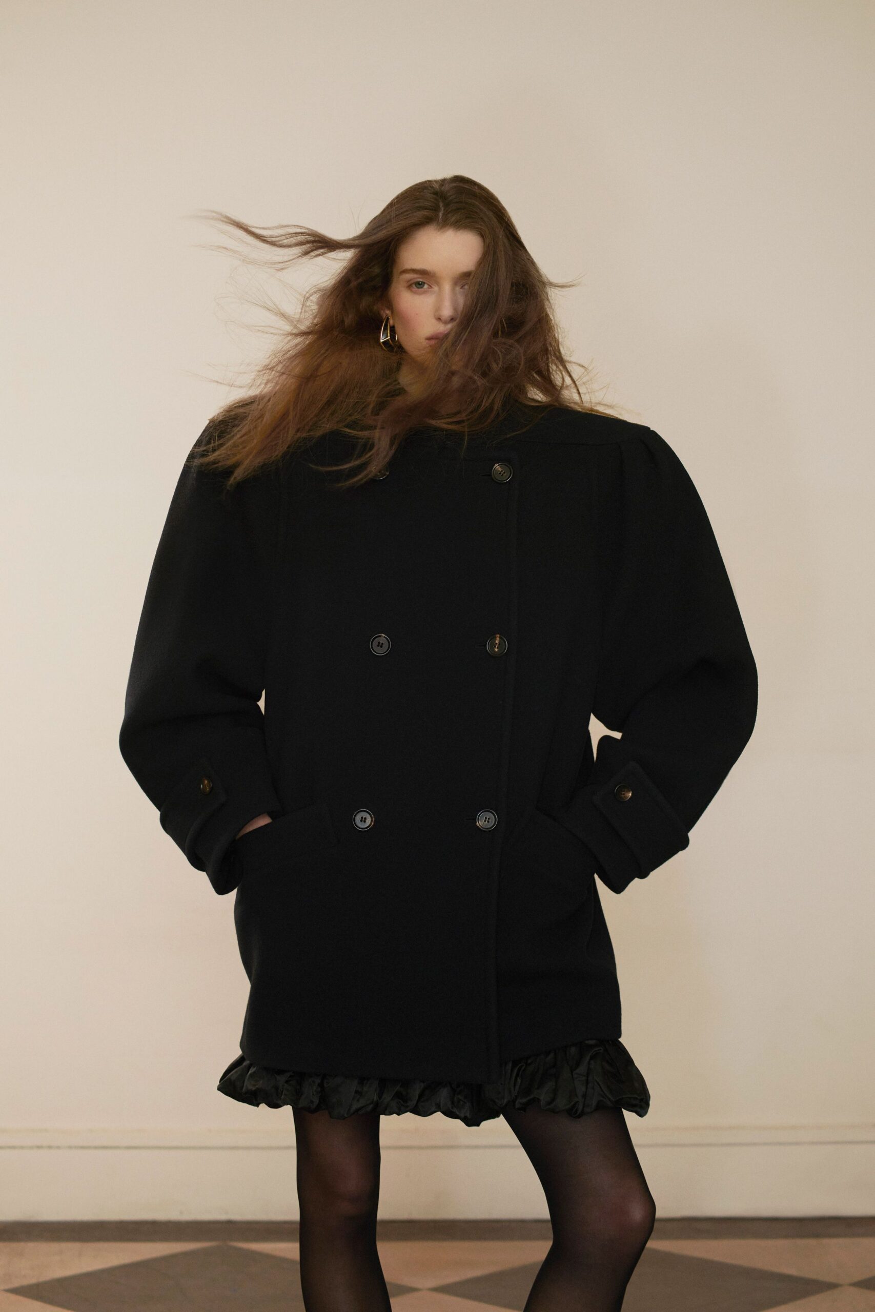 black wool long-sleeve collared oversized buttoned pockets coat