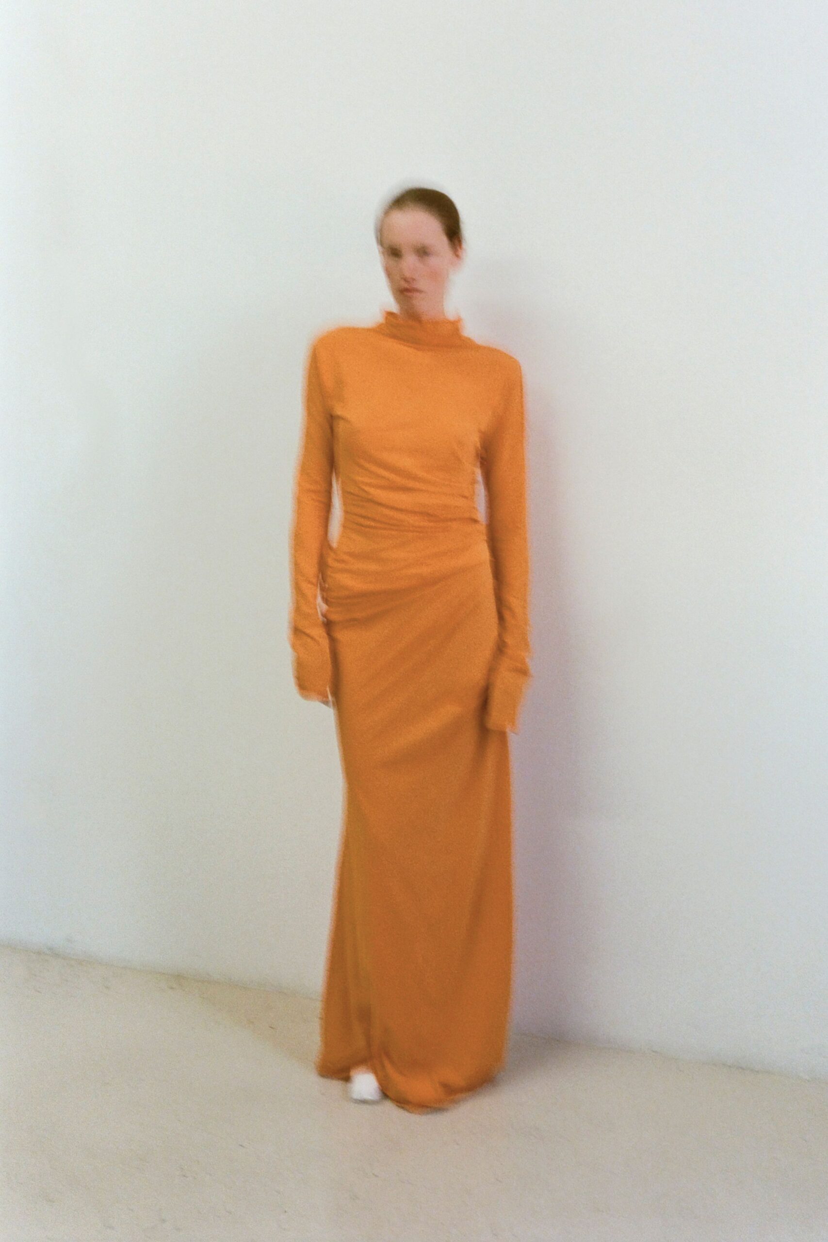 fitted orange turtleneck gown
