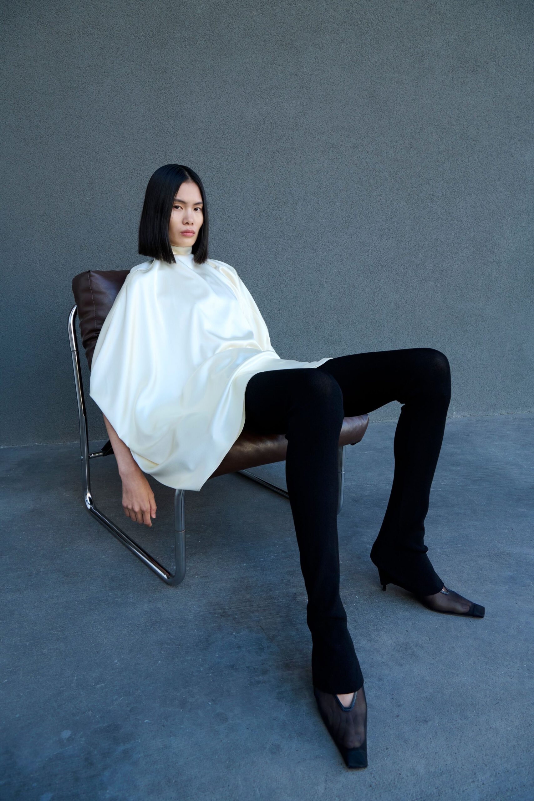 white relaxed top black fitted pants