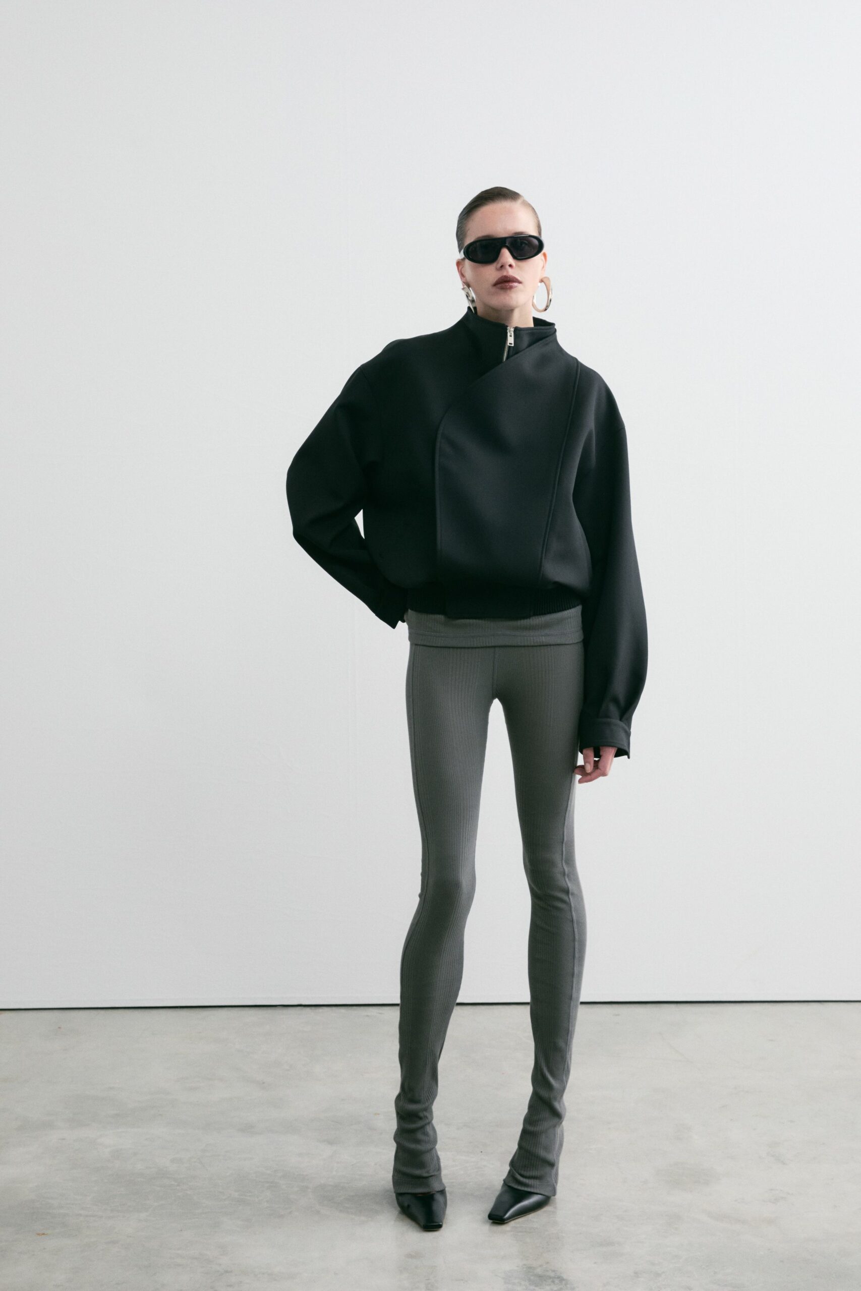 black wool long-sleeve high-neck oversized structured zippered jacket
