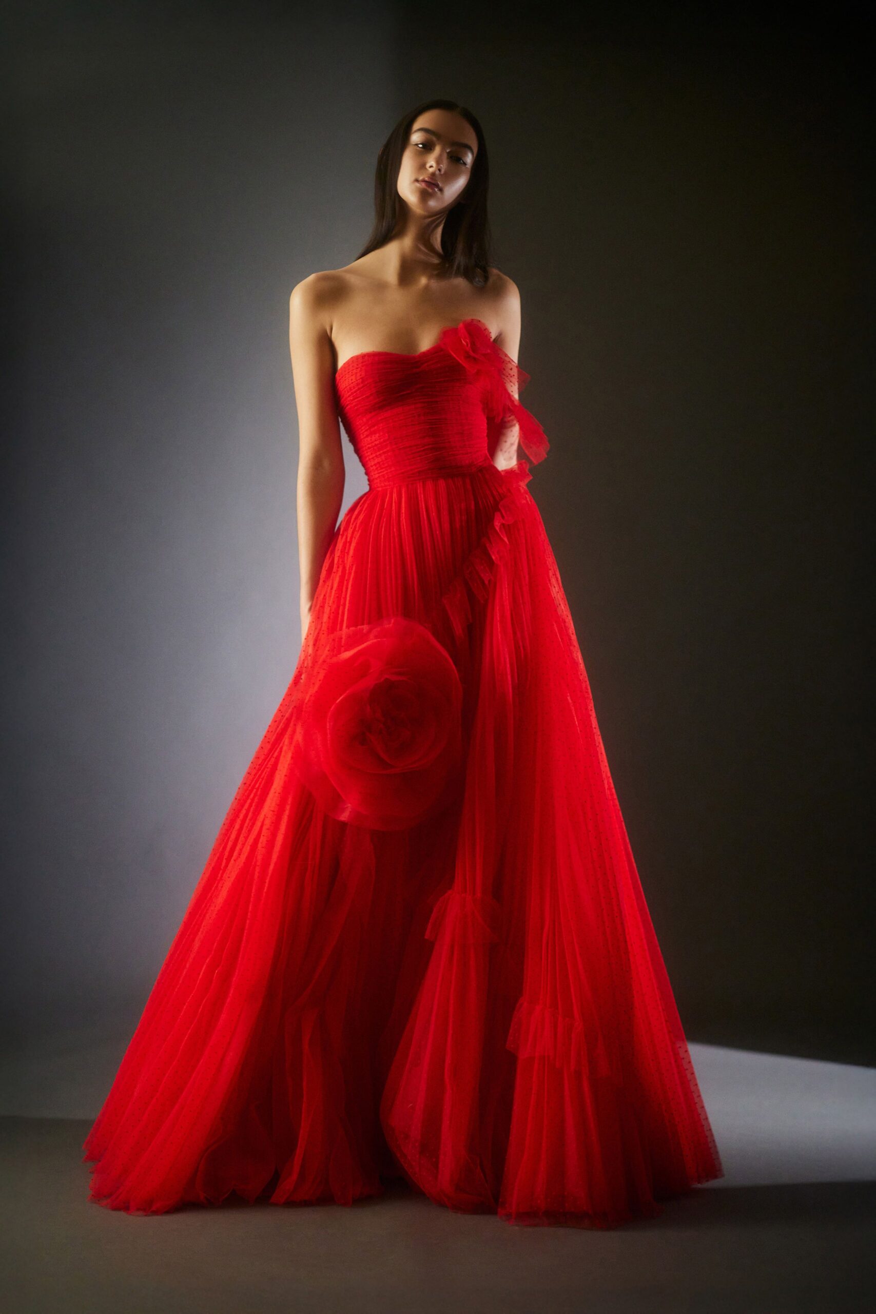 red strapless flowing gown