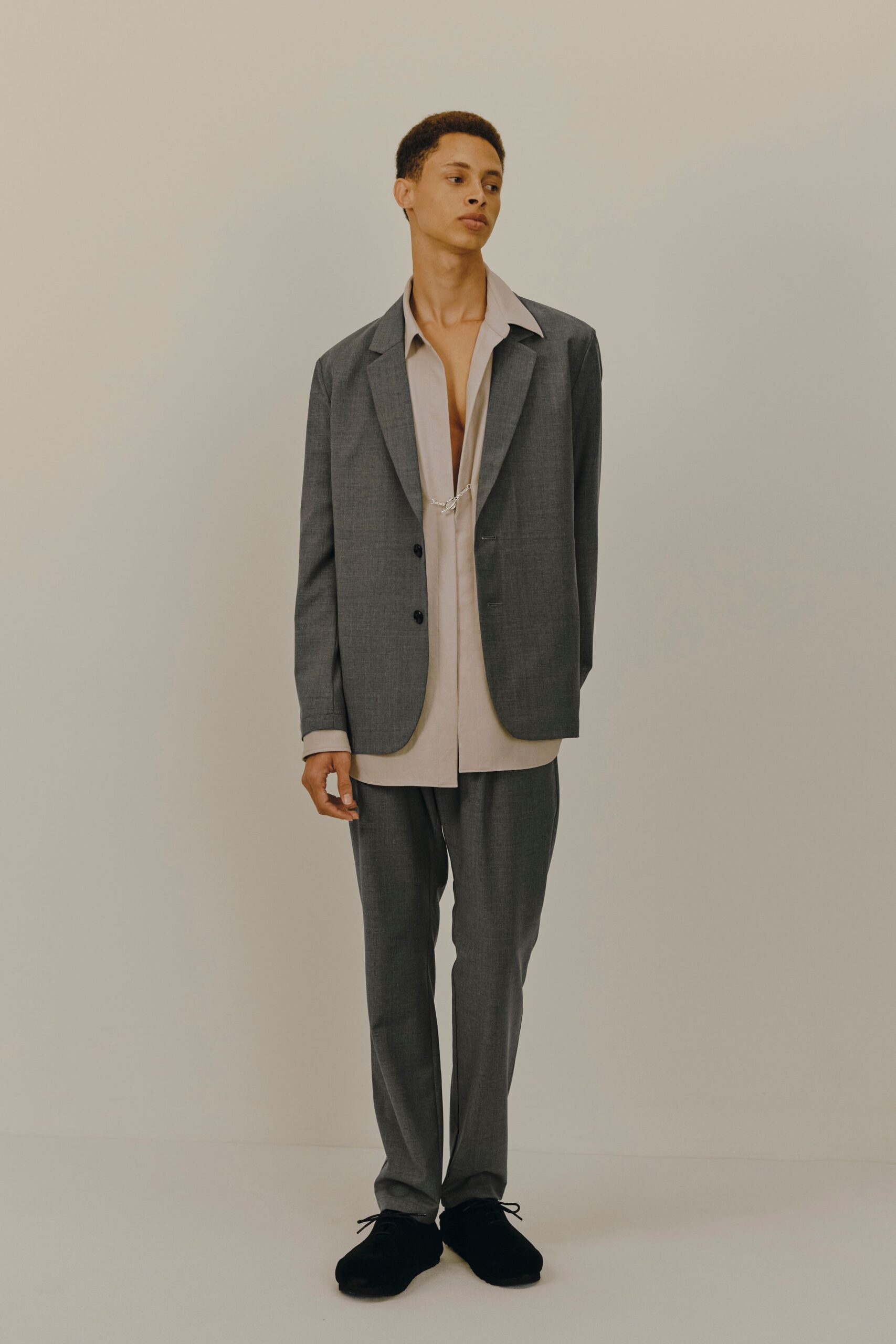 gray blazer pink shirt tailored pants