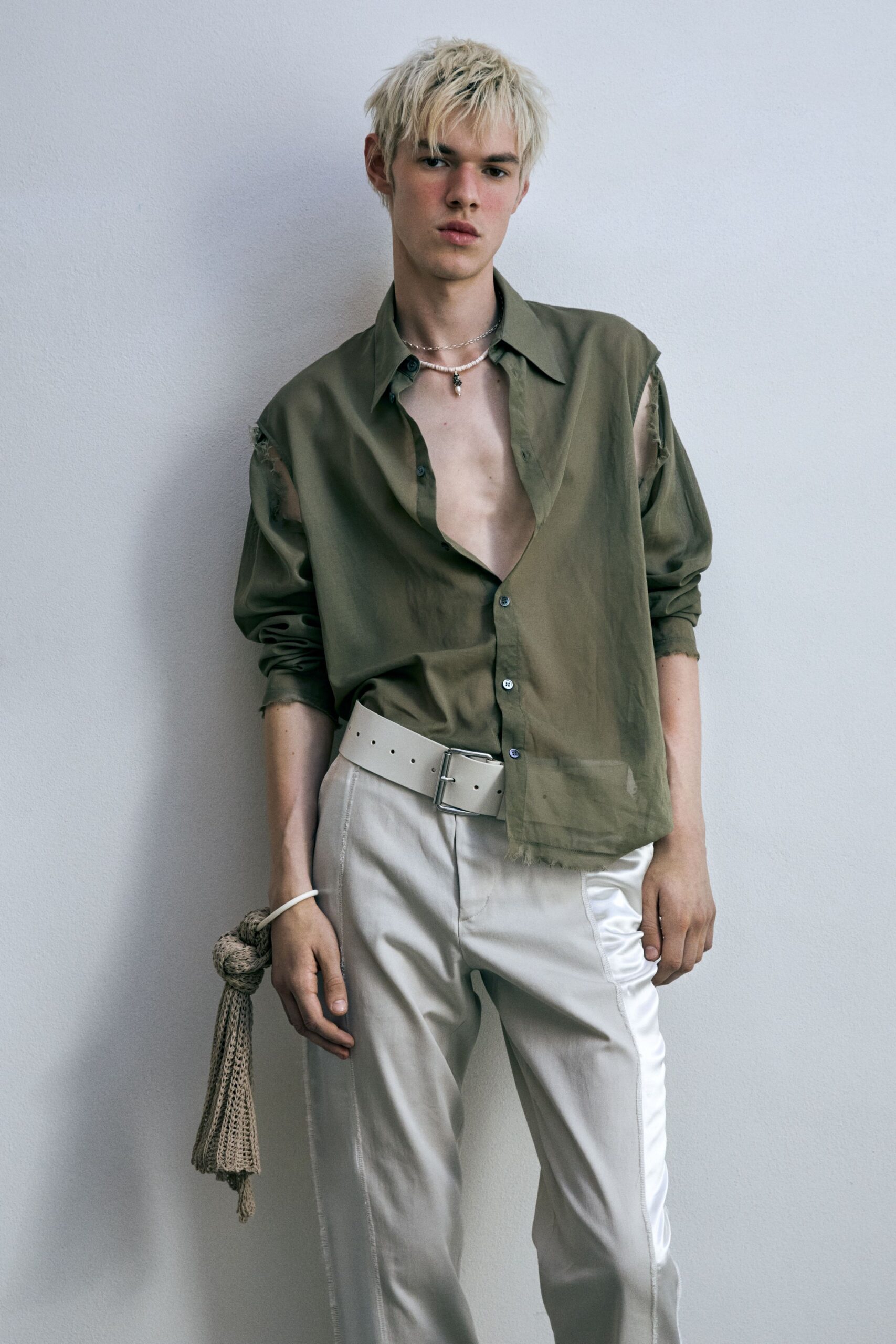 green relaxed shirt white pants