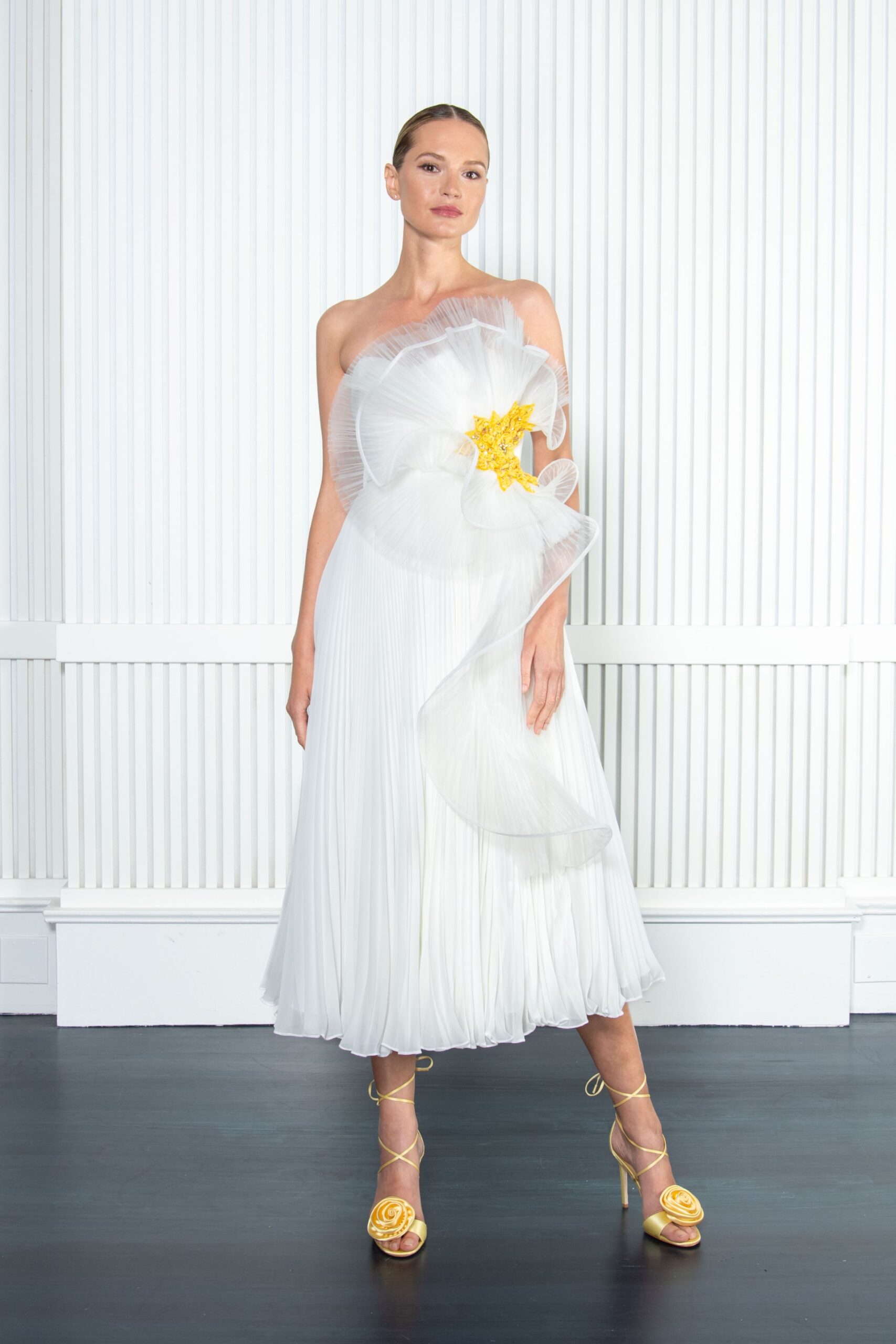 white silk strapless fitted pleated draped flowing dress
