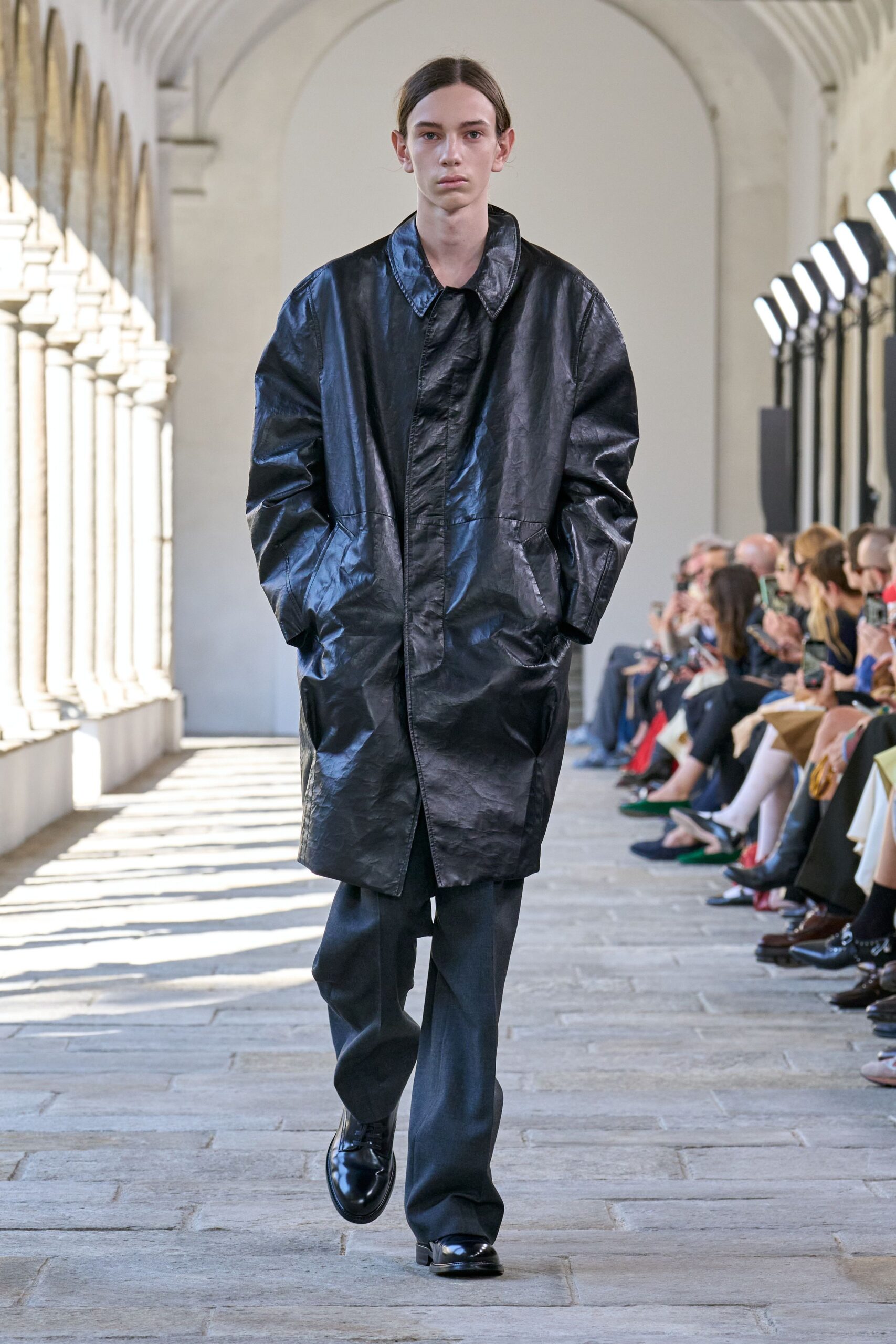 black leather coat with gray pants