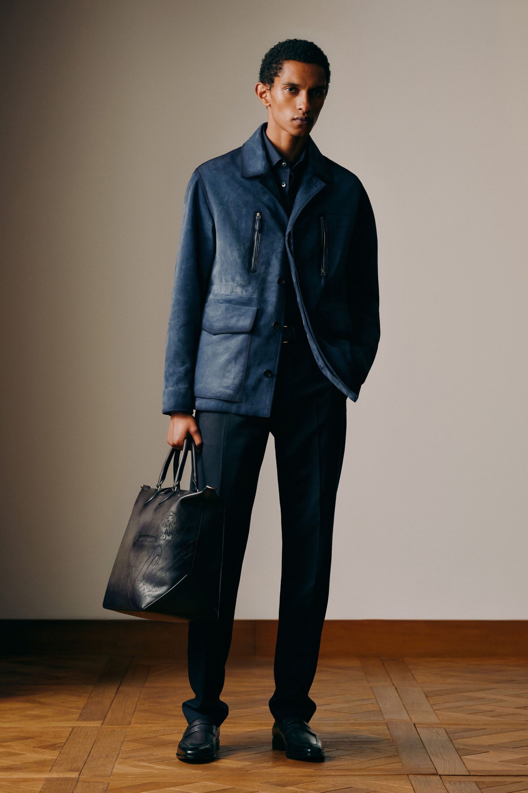 blue leather long-sleeve collared fitted zippered pockets jacket