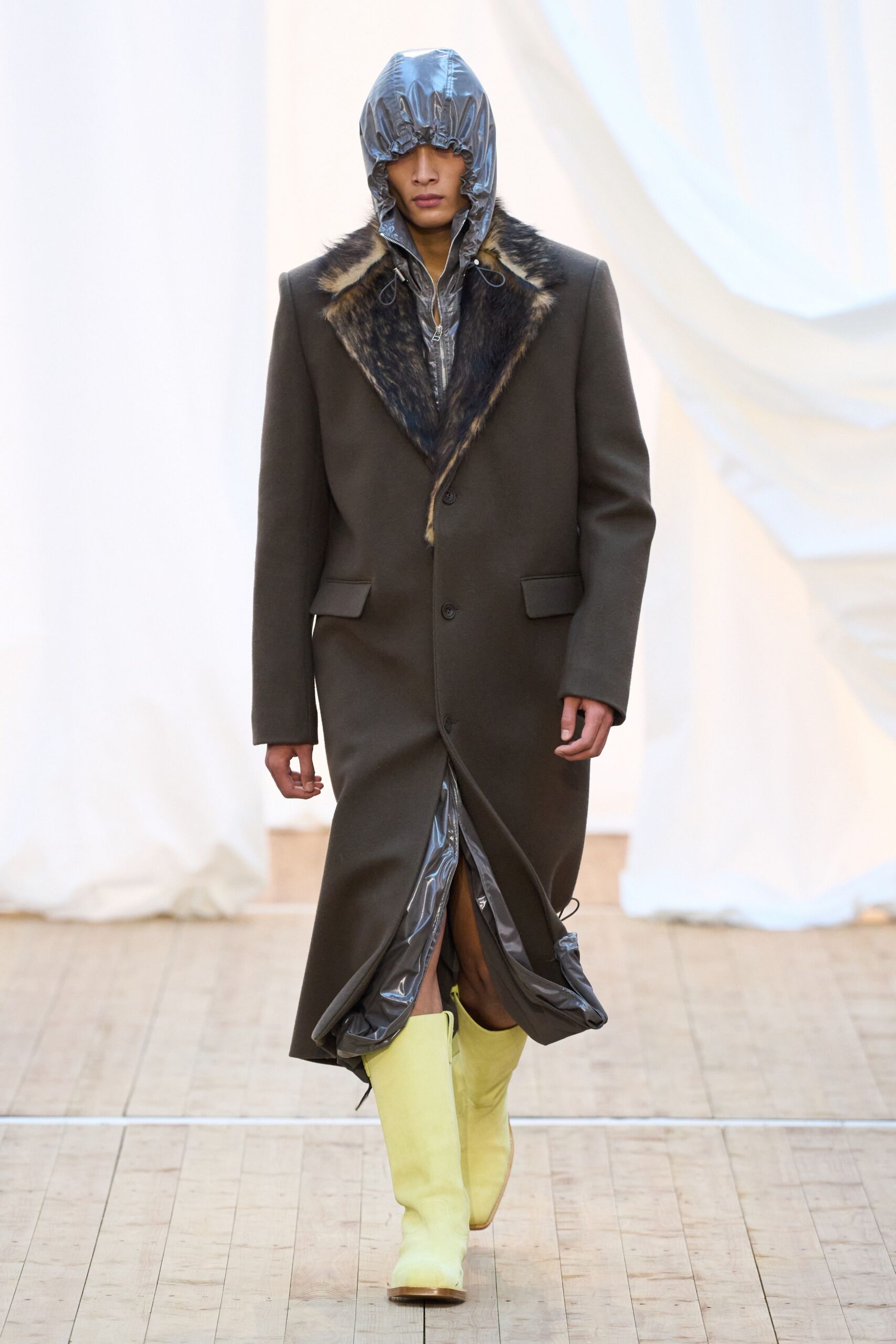 brown wool coat with yellow boots