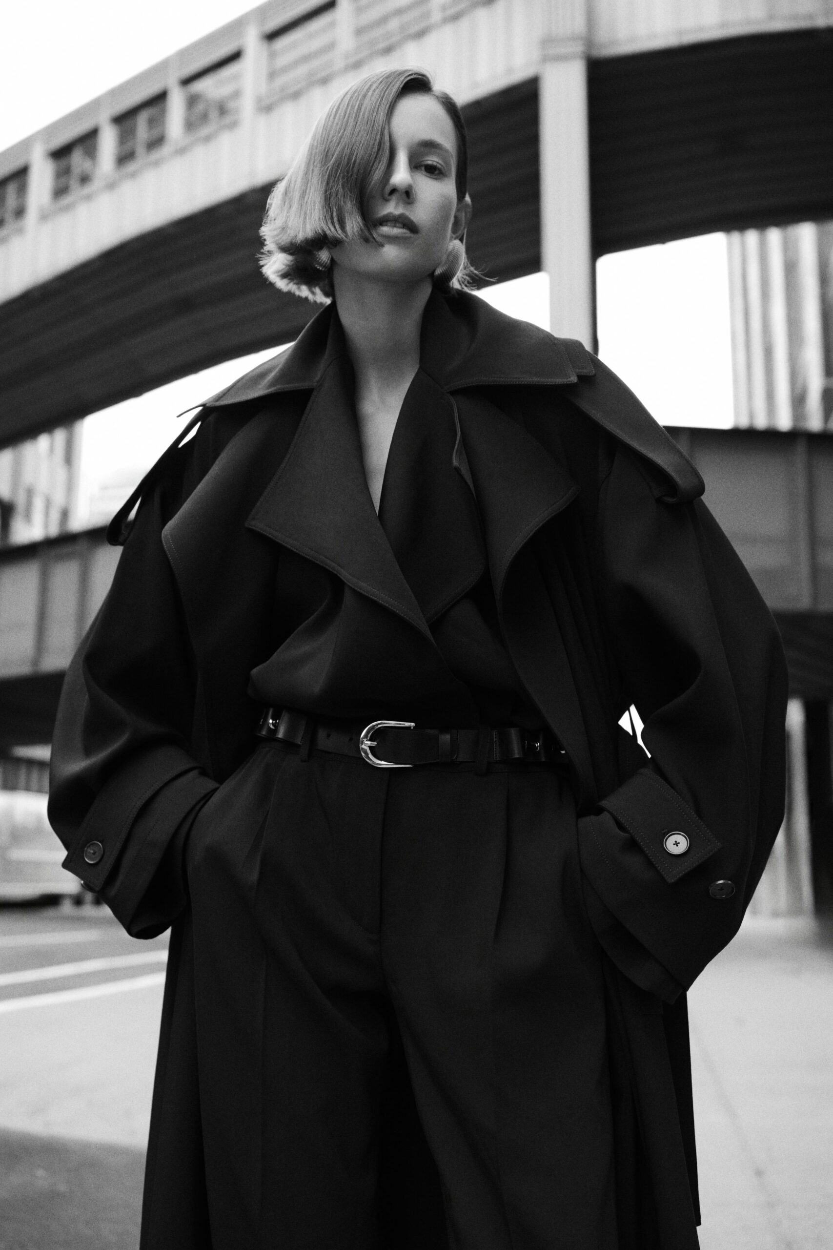 black wool long-sleeve collared oversized draped layered coat