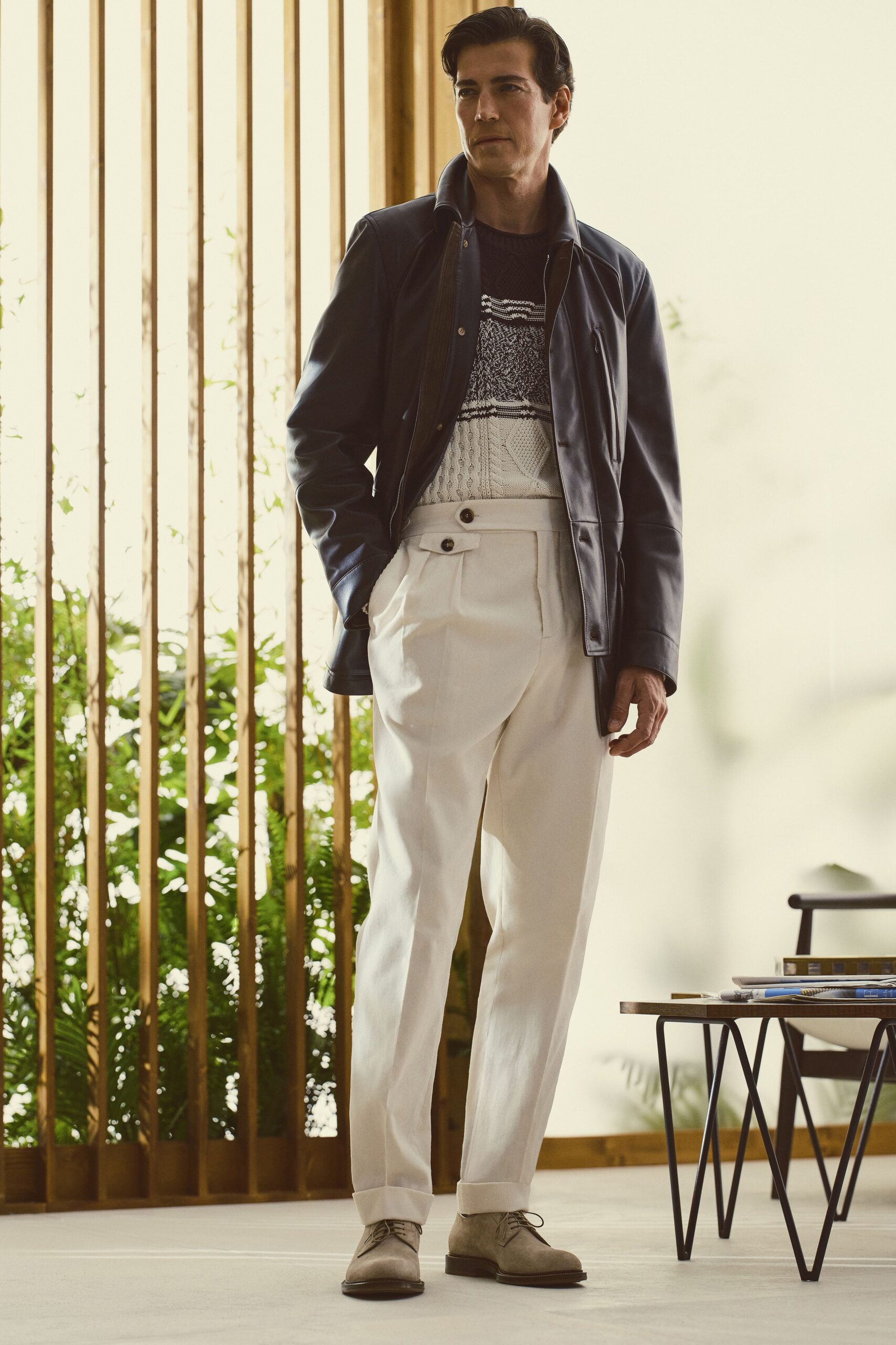 black leather jacket with tailored pants