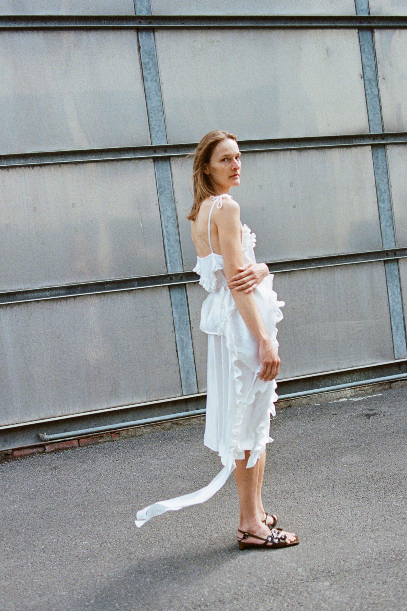 white ruffled midi dress with black shoes