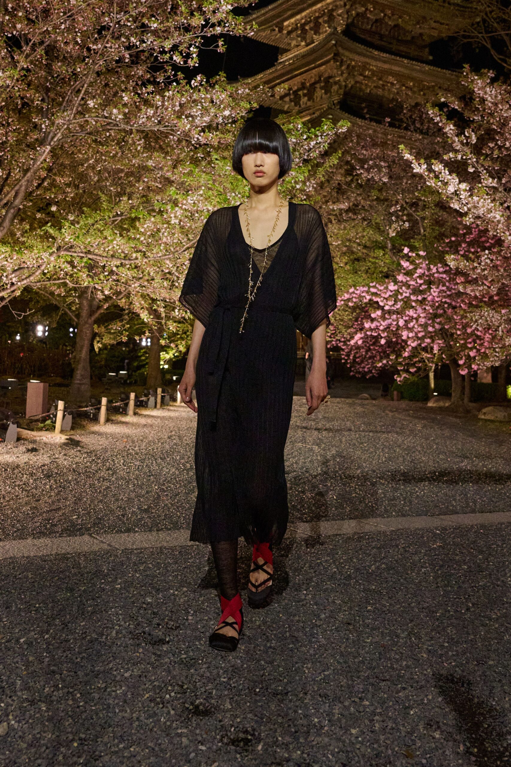 black pleated maxi dress with strappy shoes