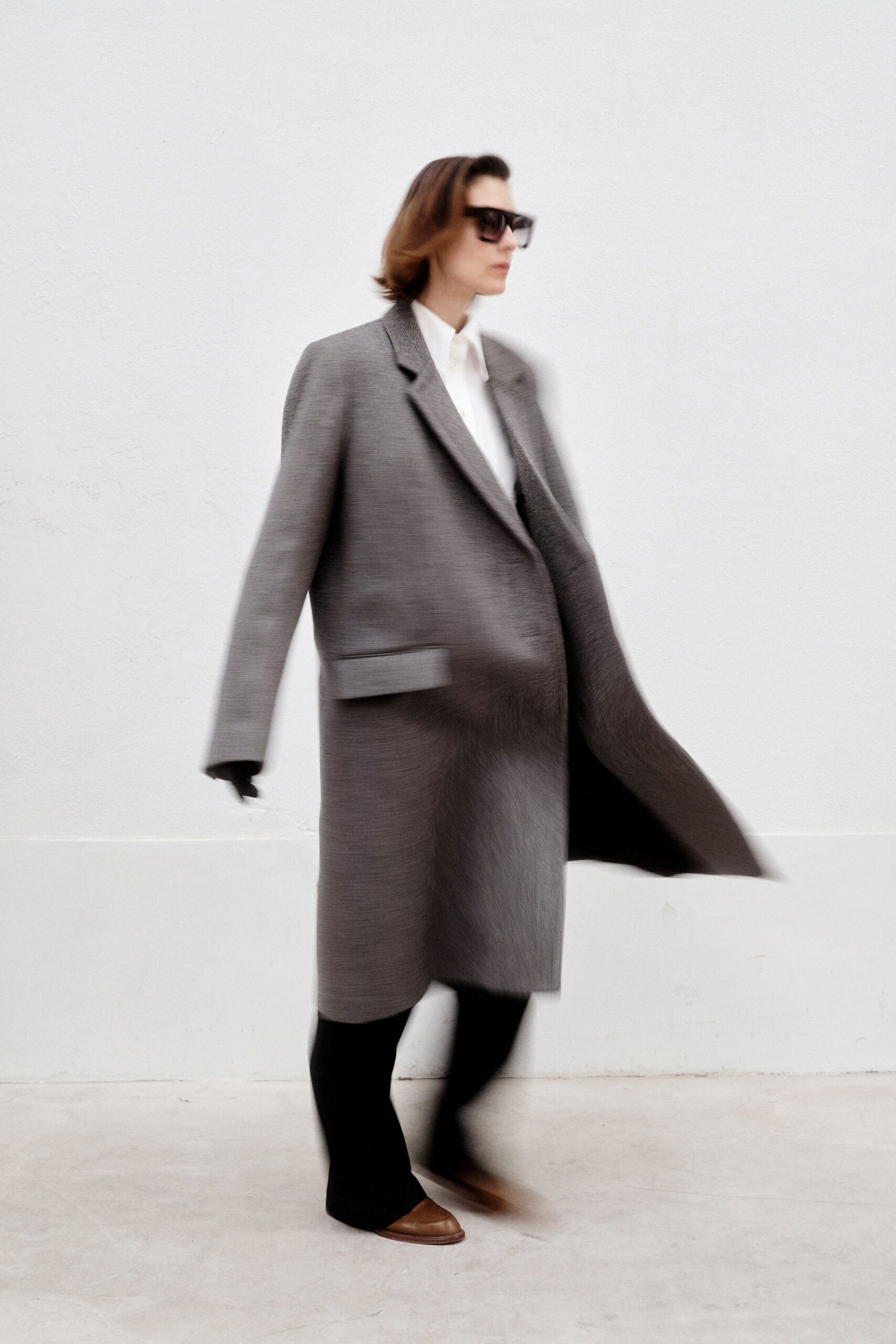 gray oversized coat with black pants