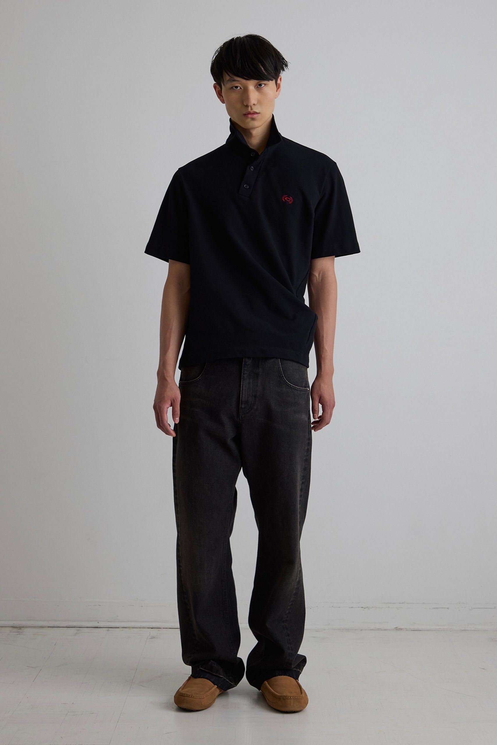 black relaxed shirt gray pants brown shoes