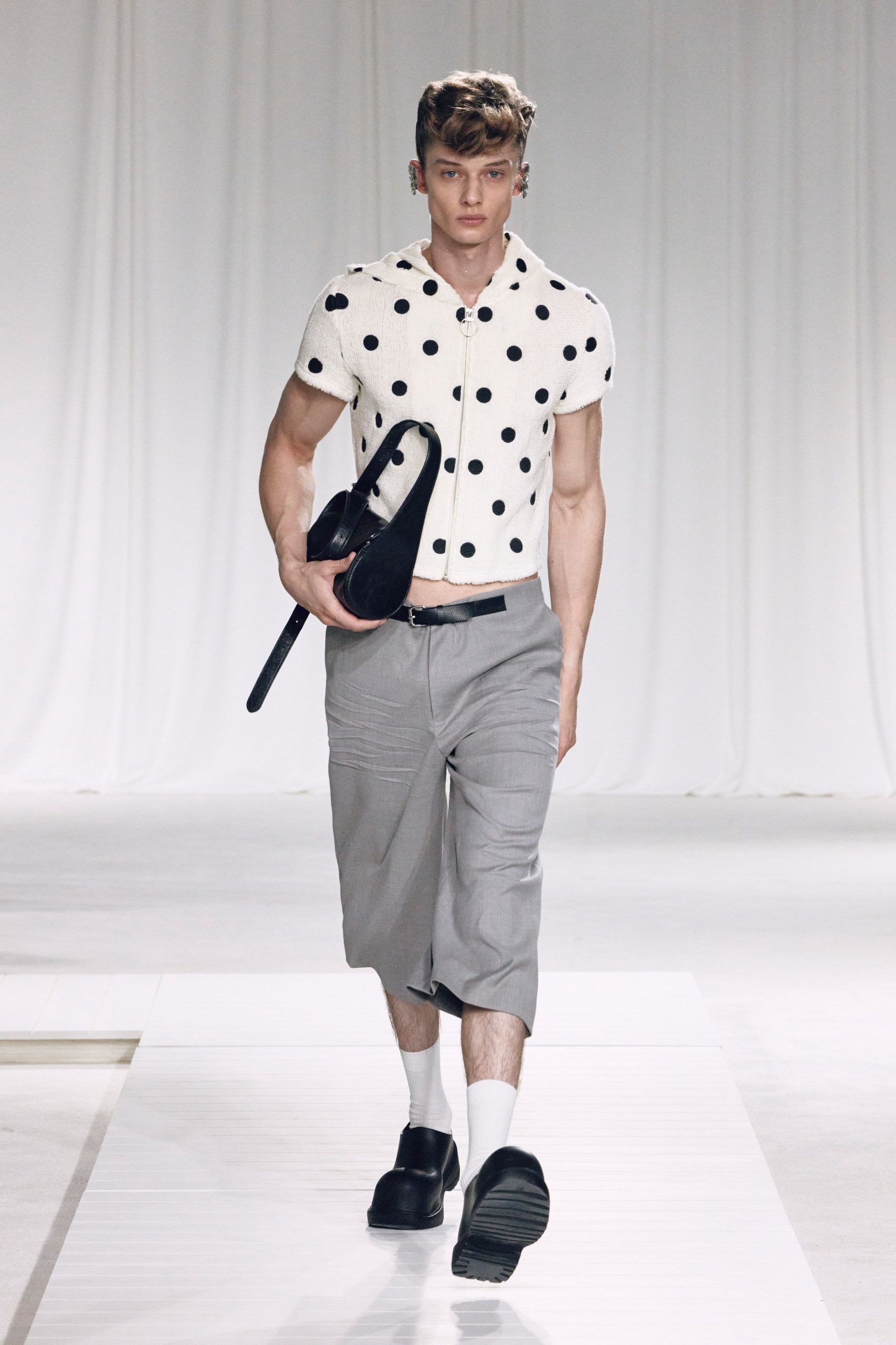 polka-dot shirt and gray pants