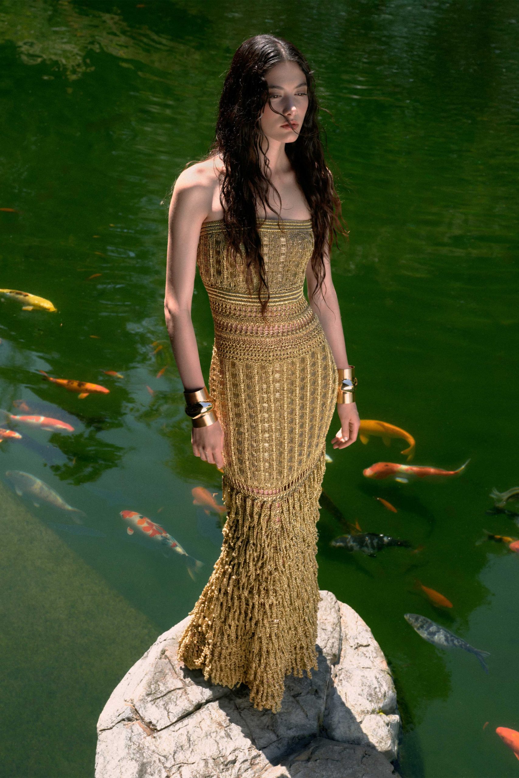 gold strapless pleated gown