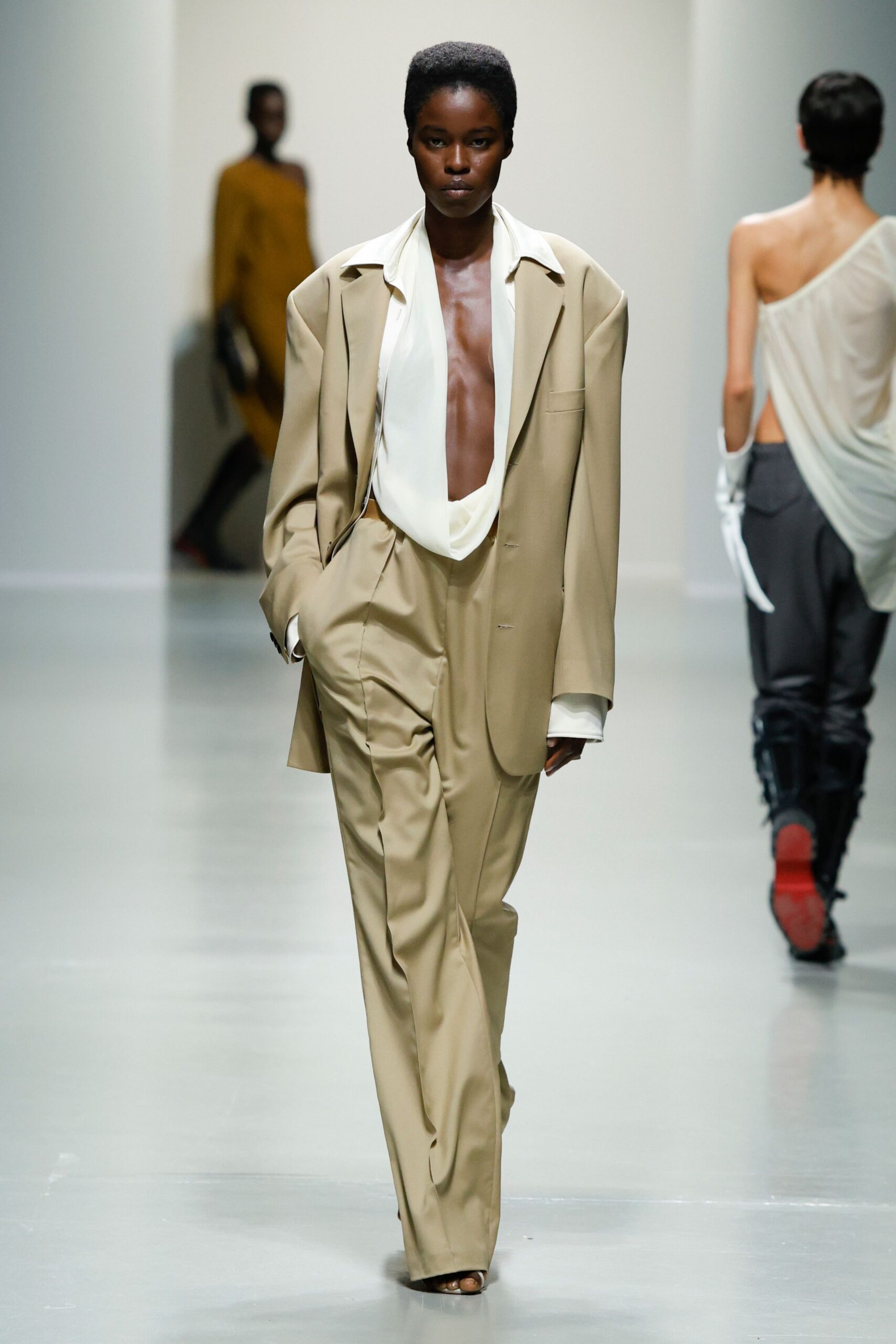 beige relaxed suit with white shirt