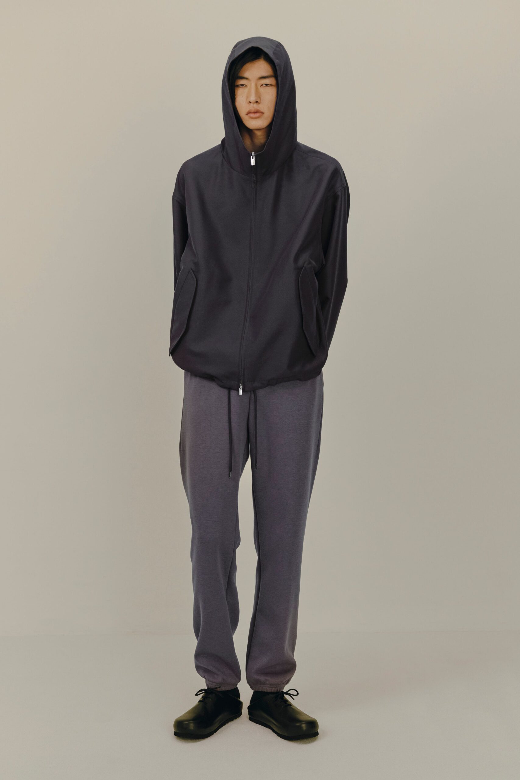 black hooded jacket gray pants