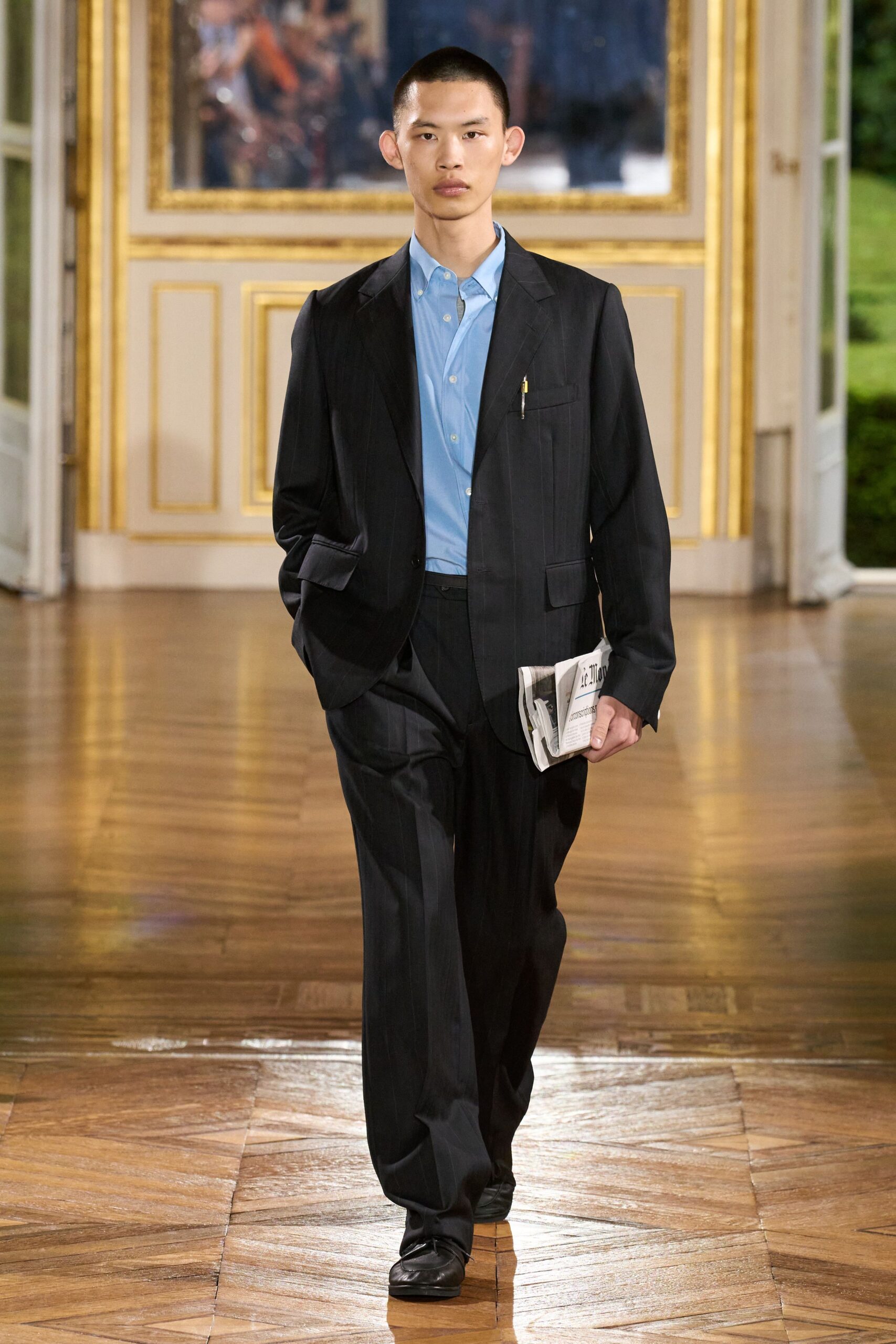 black tailored suit with blue shirt