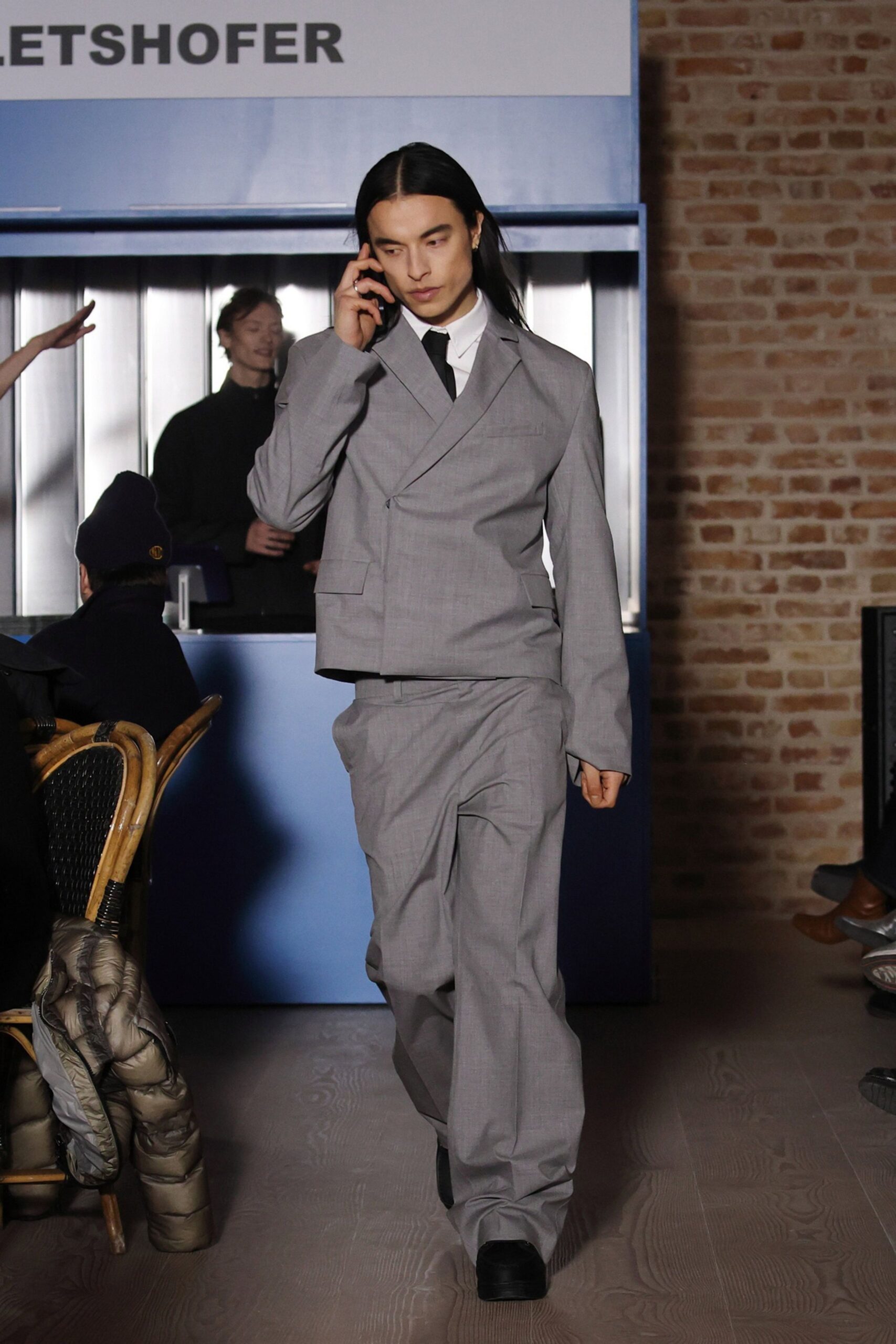 gray tailored suit with black shoes