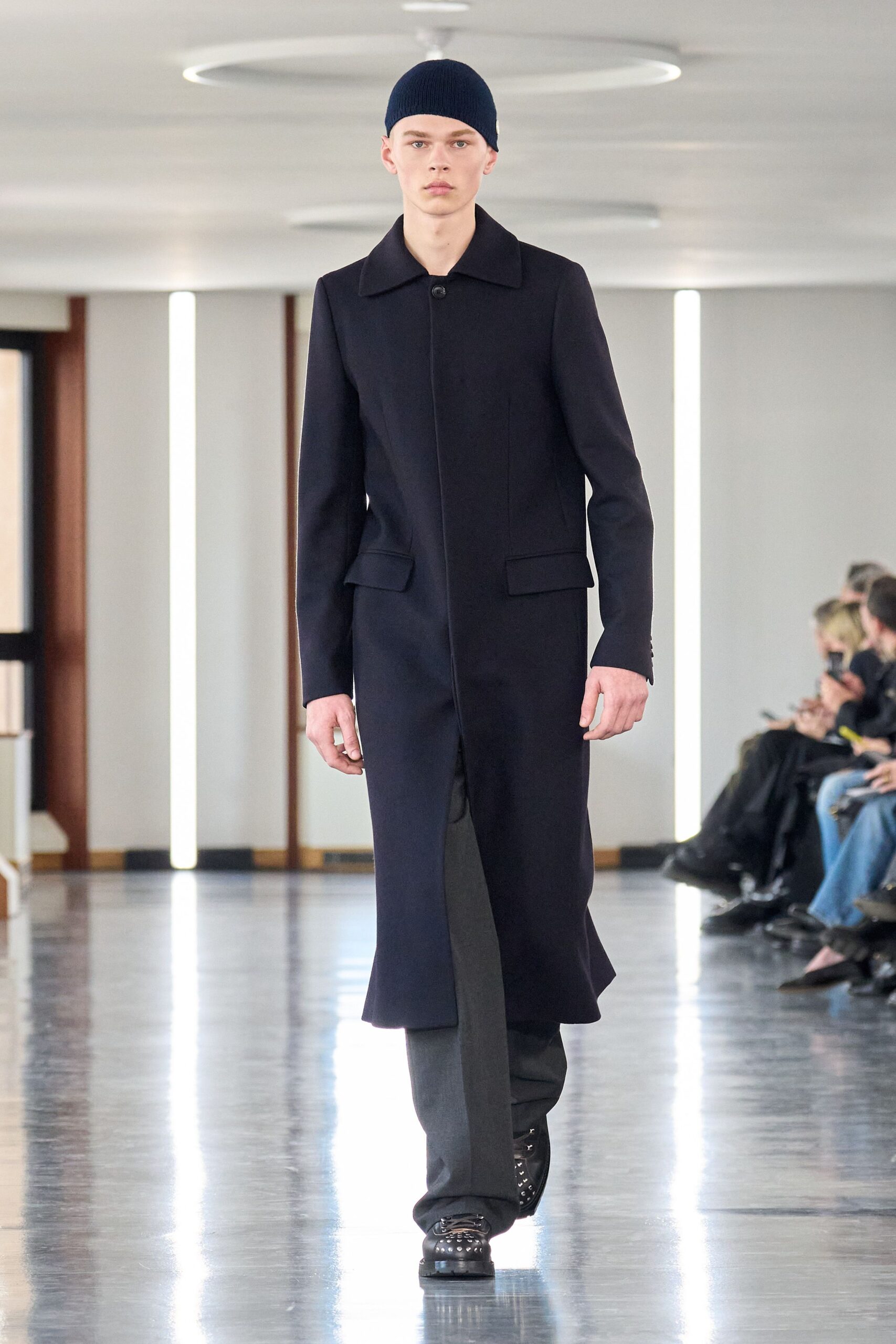 black wool fitted coat with gray pants
