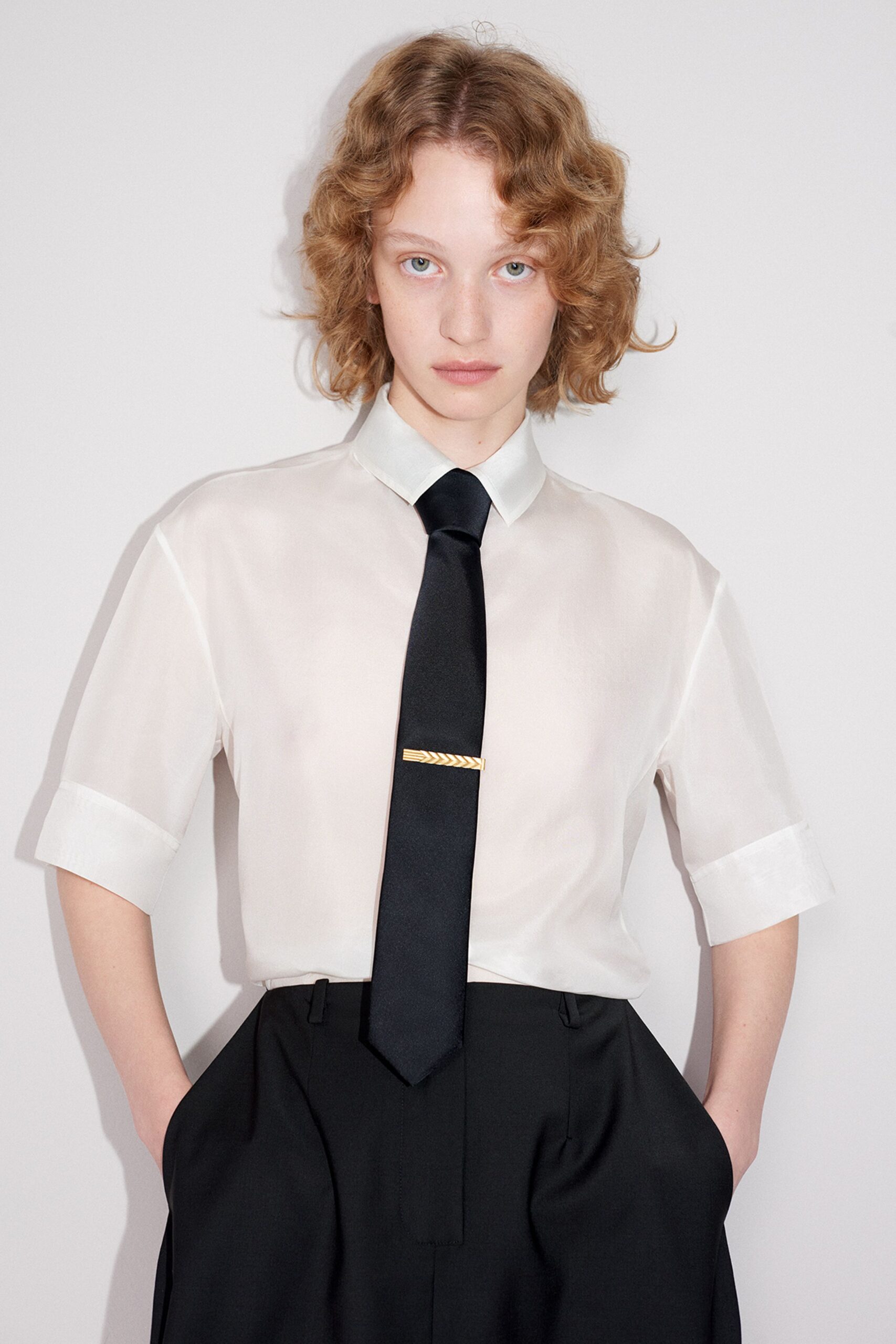 white silk shirt black pants