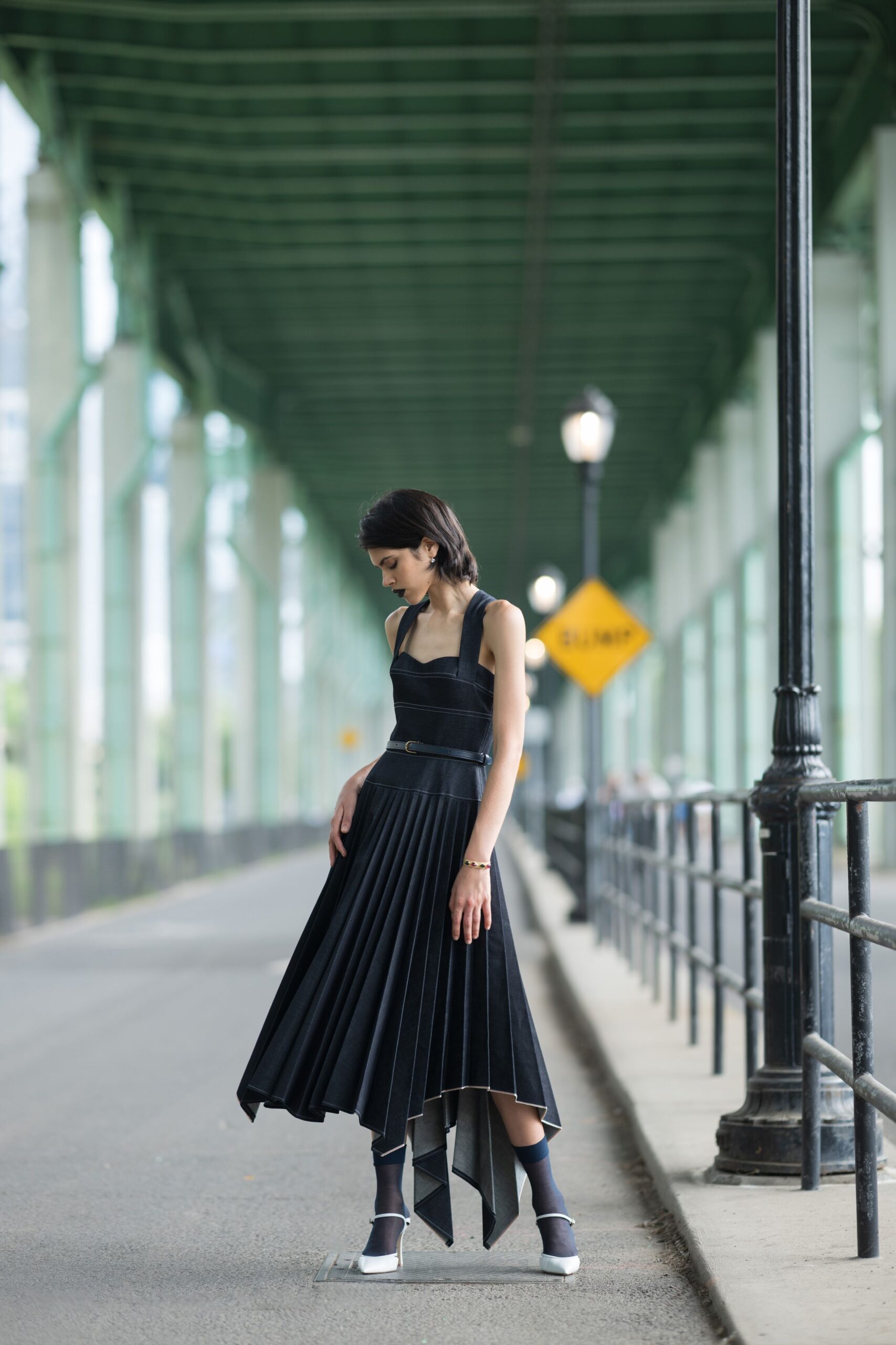 black pleated midi dress with white shoes