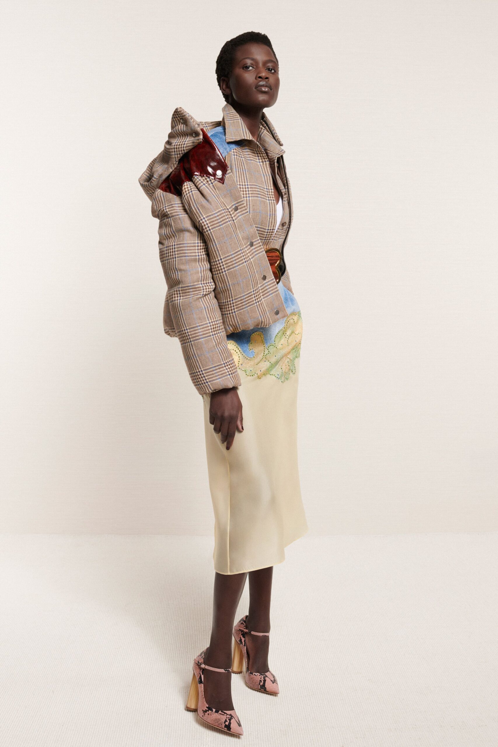 brown checked jacket with beige skirt