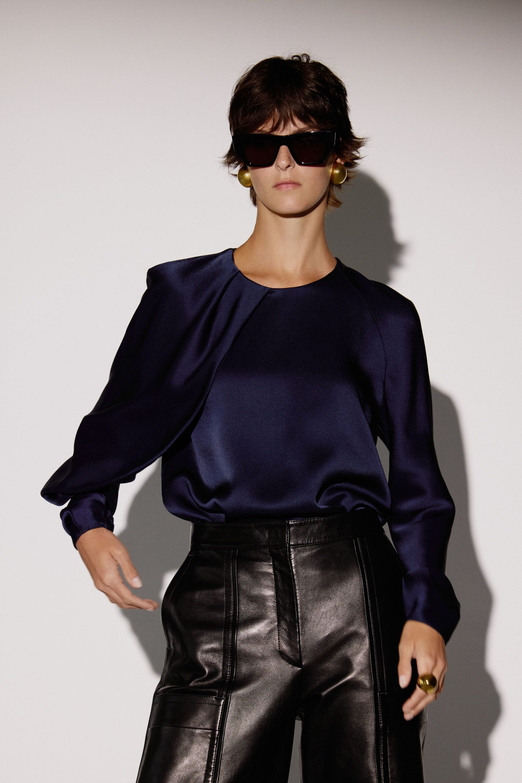 blue silk long-sleeve v-neck fitted draped shiny top