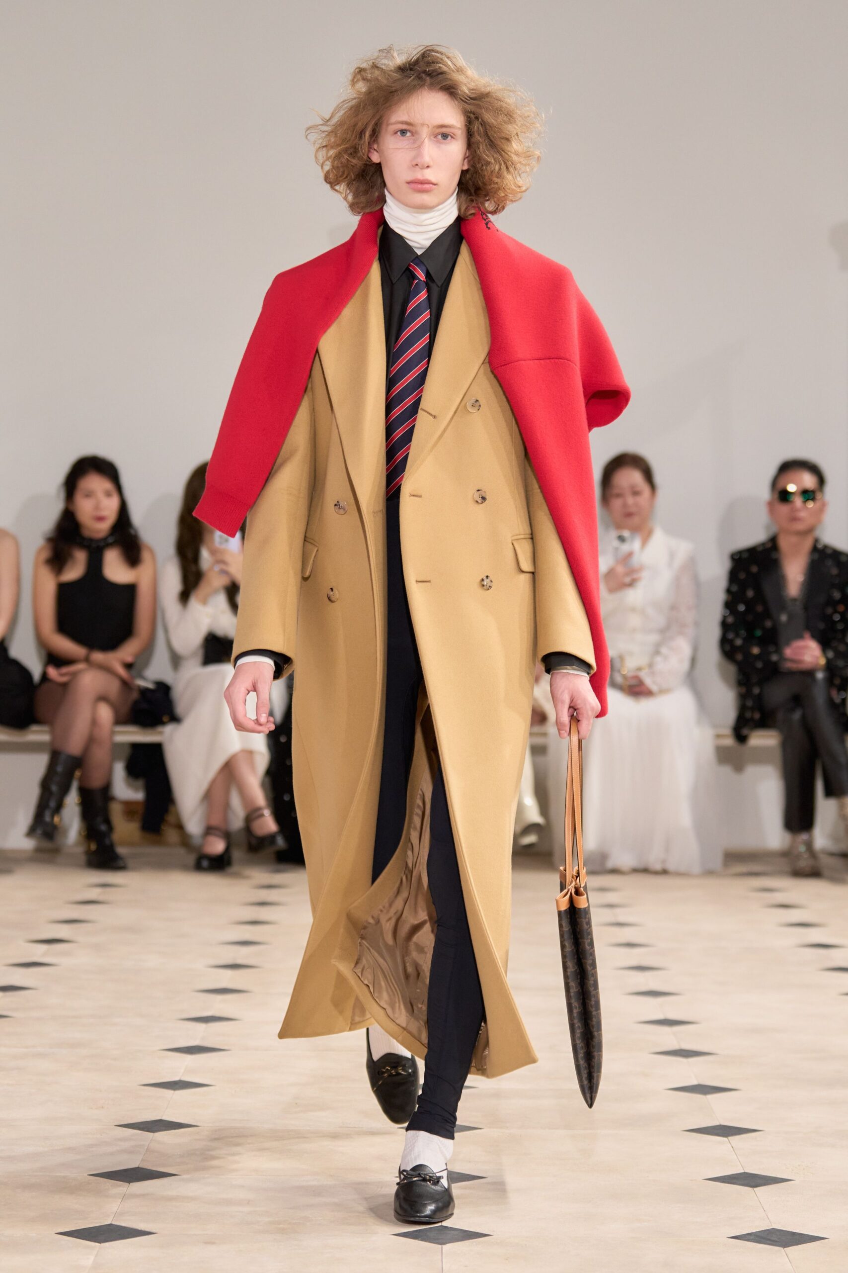 beige coat with red scarf