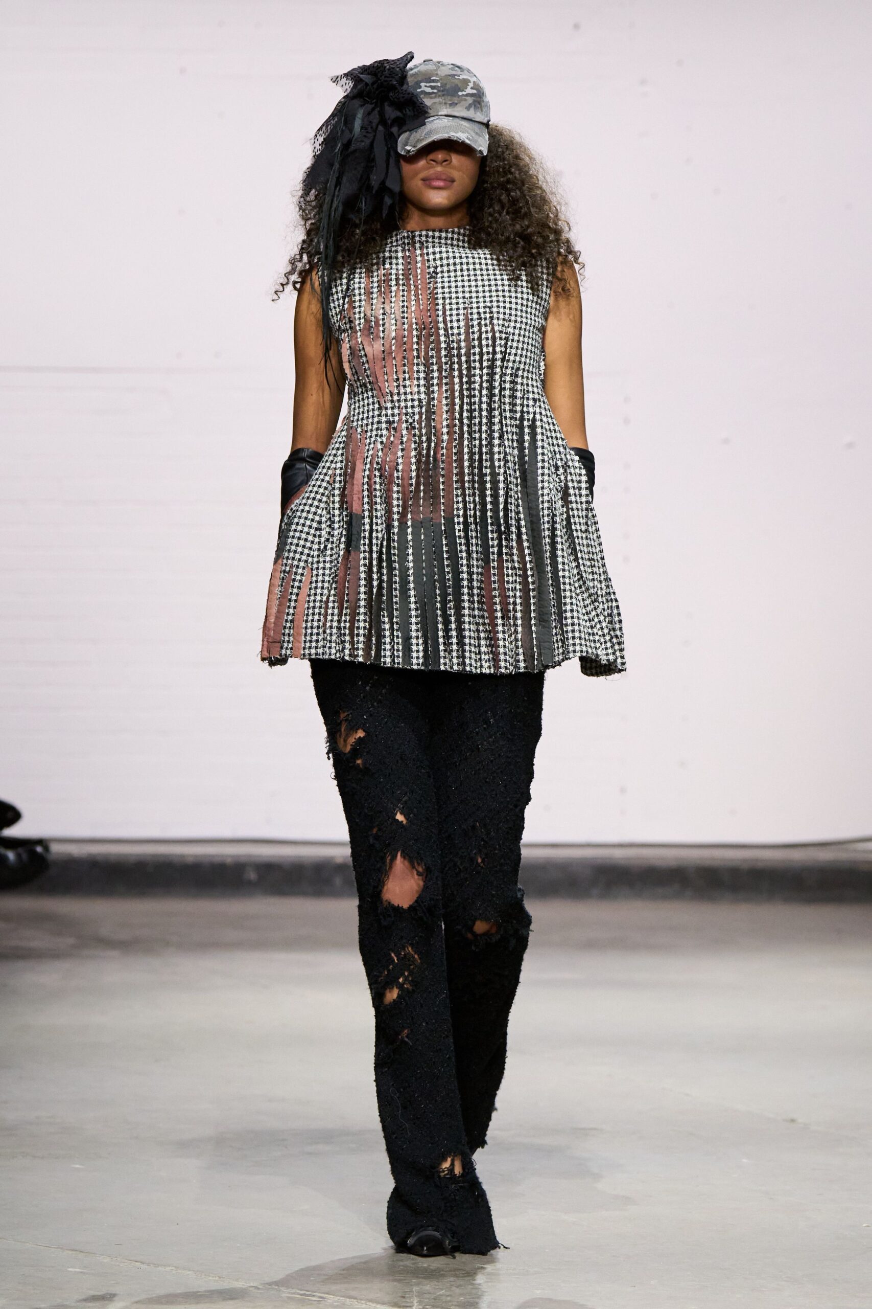black and white pleated top with distressed pants