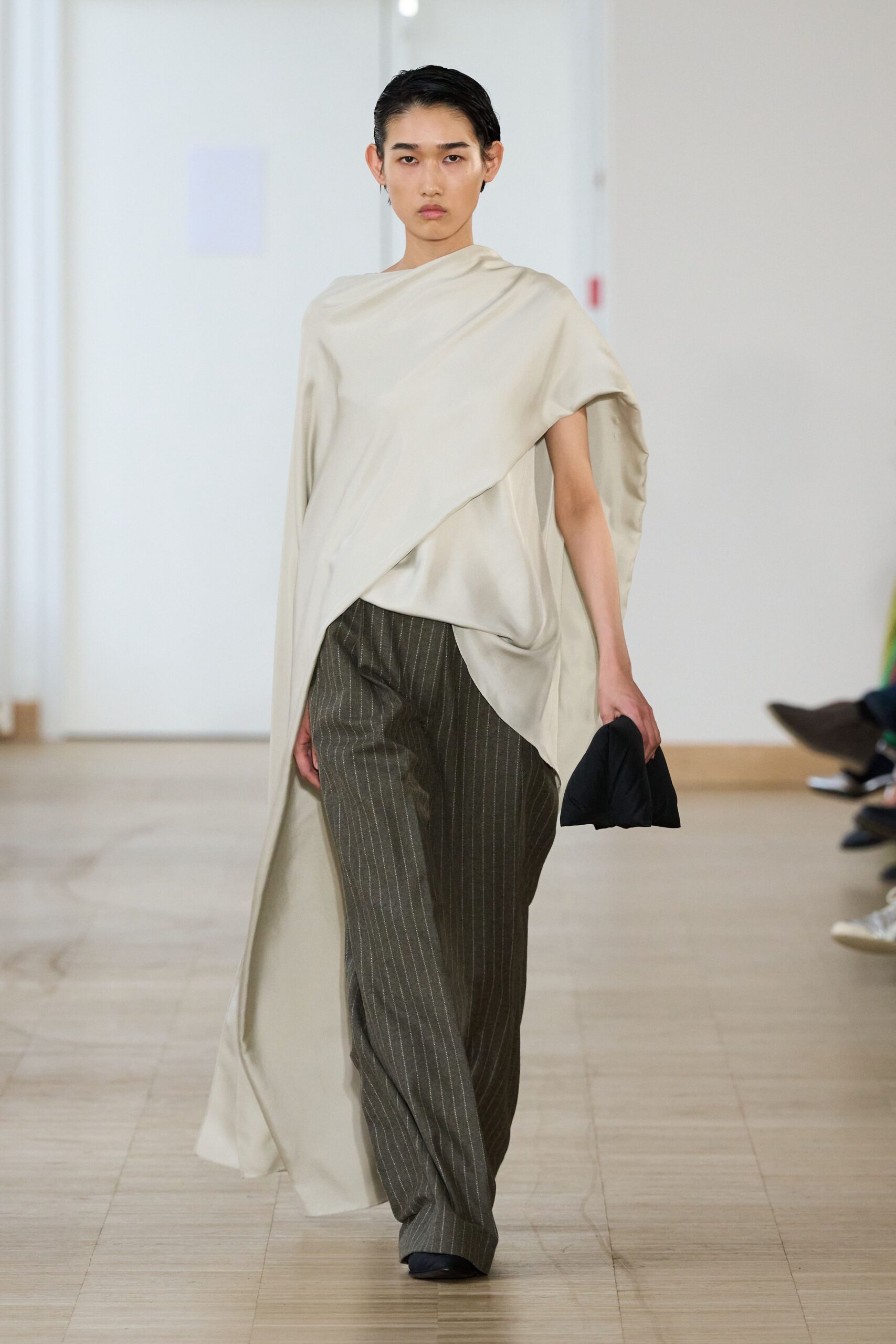 beige silk cape with gray pants