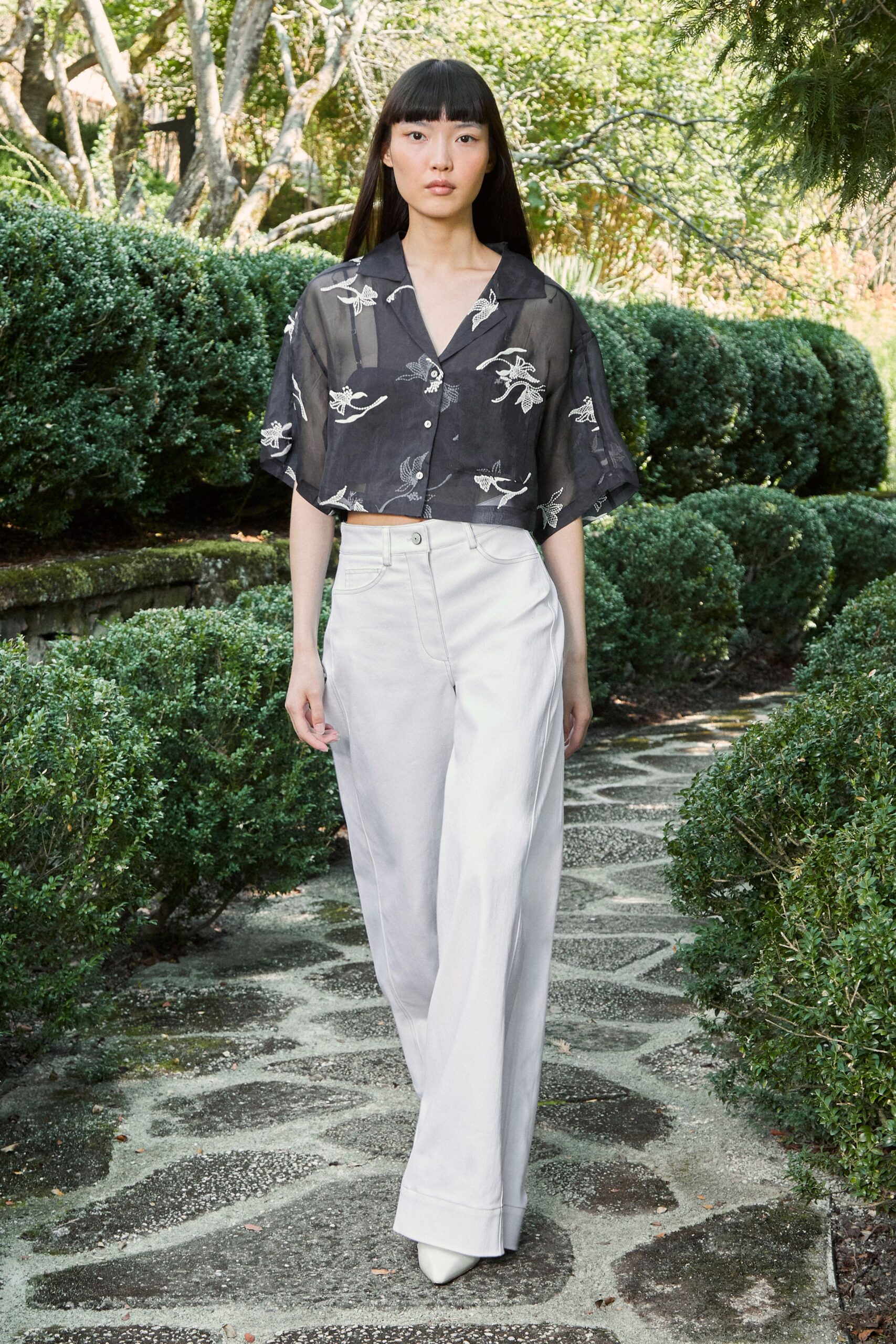 black embroidered top white pants