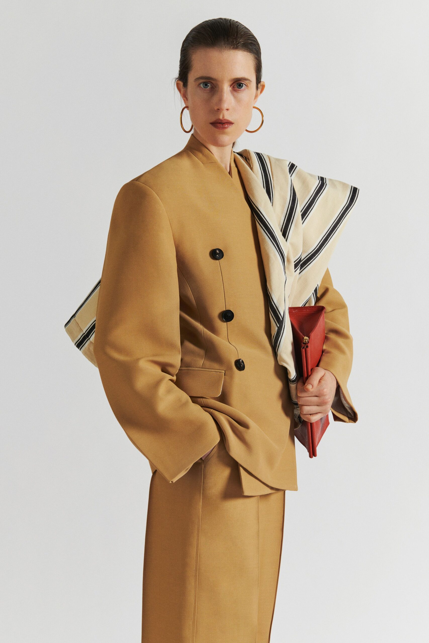 beige blazer and tailored pants