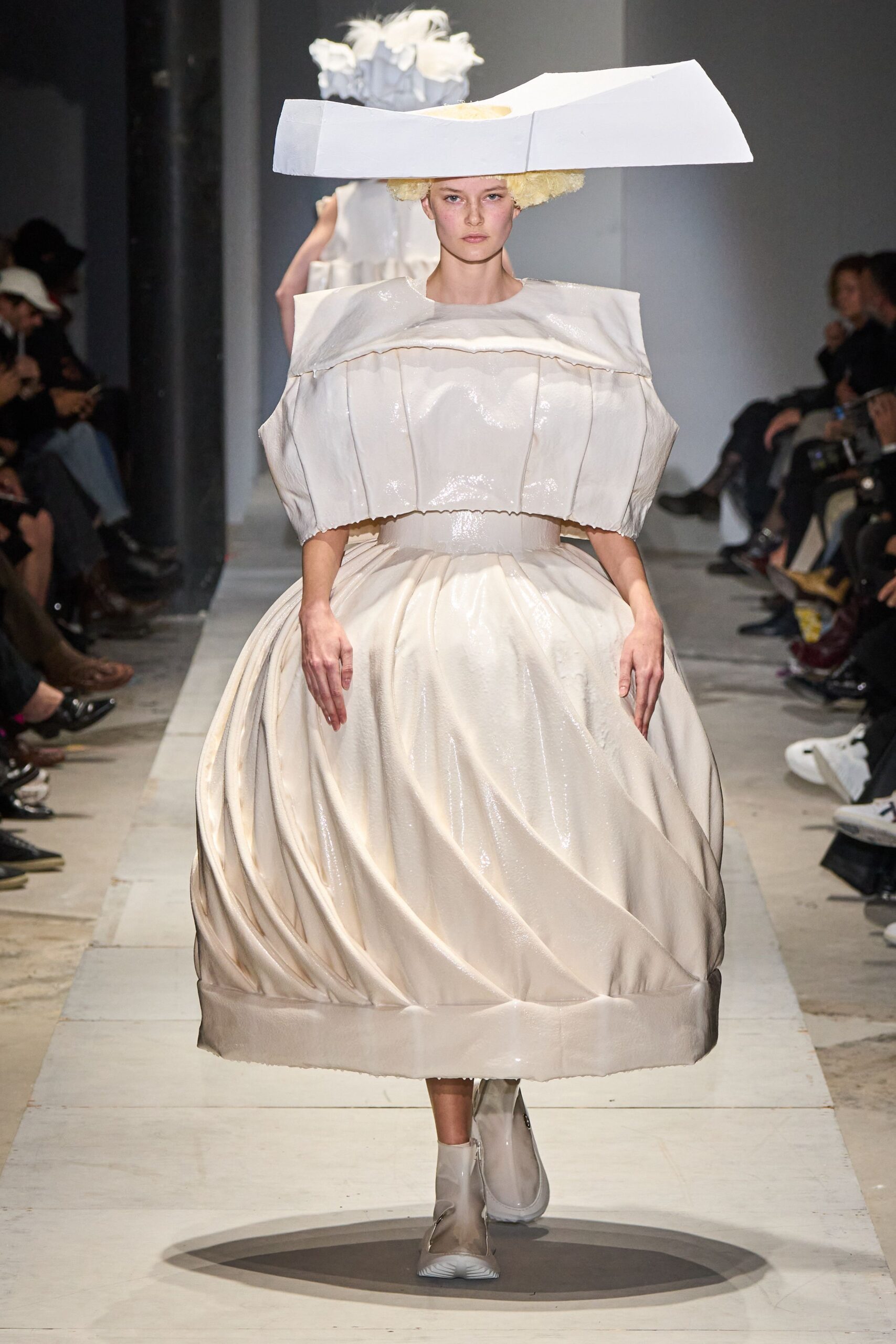 white vinyl sleeveless high-neck structured pleated draped dress