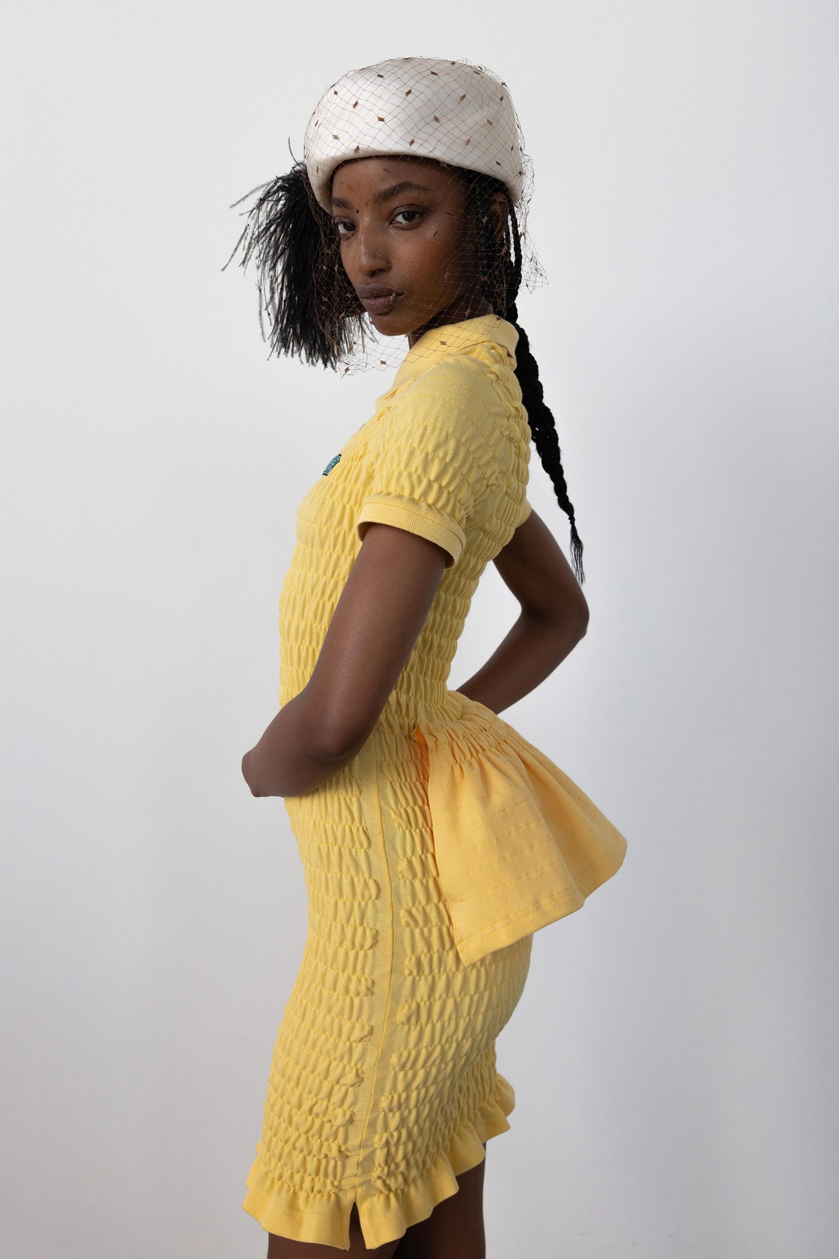 yellow fitted mini dress with hat