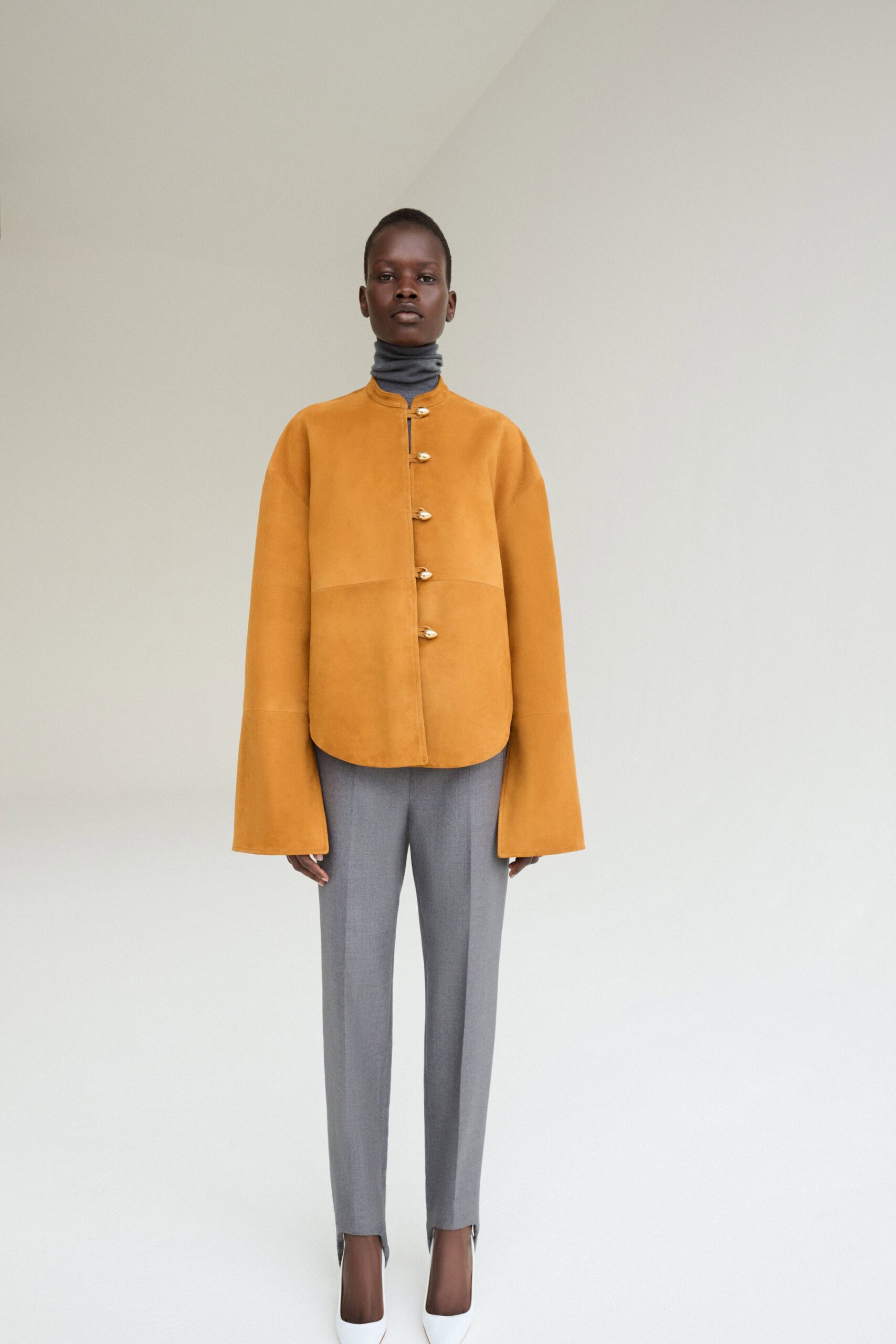 orange suede jacket with gray top