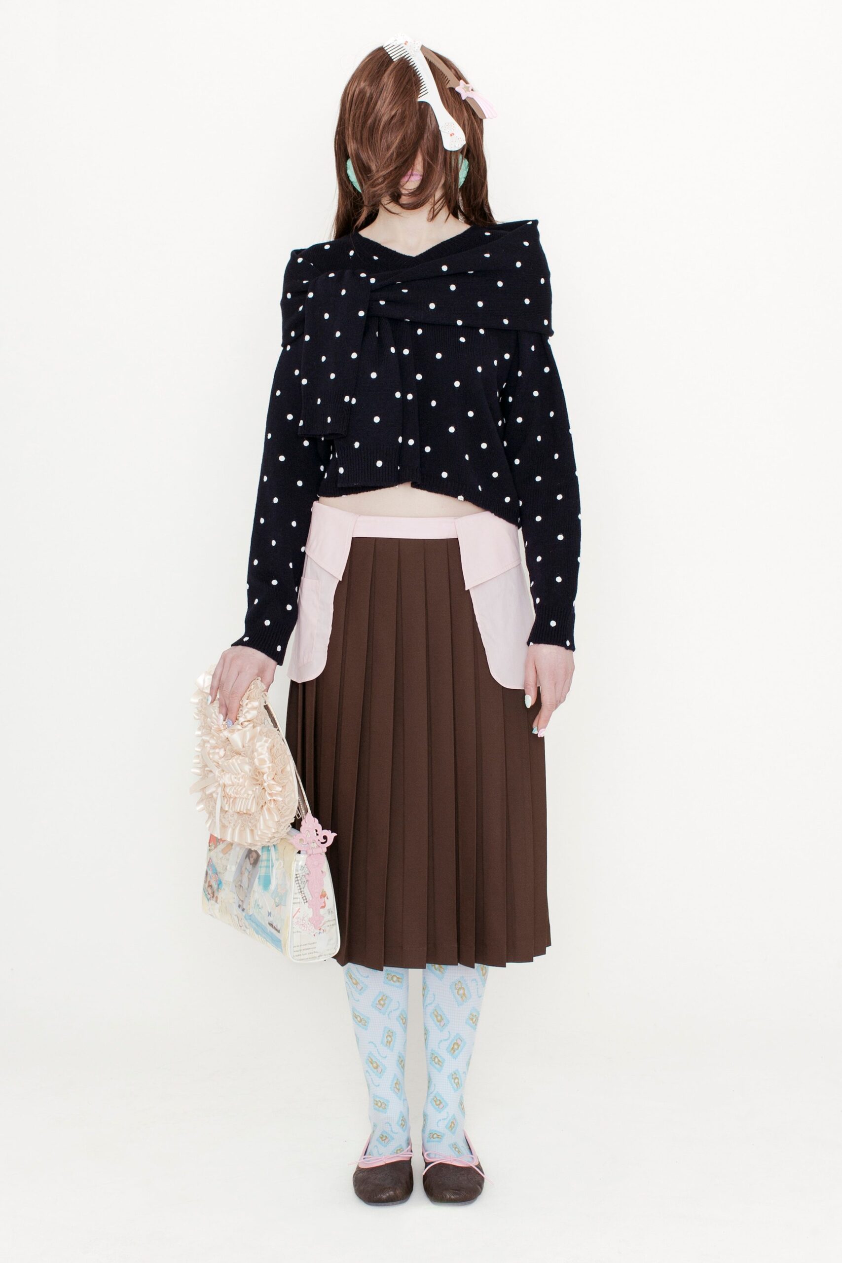black polka-dot top with brown skirt