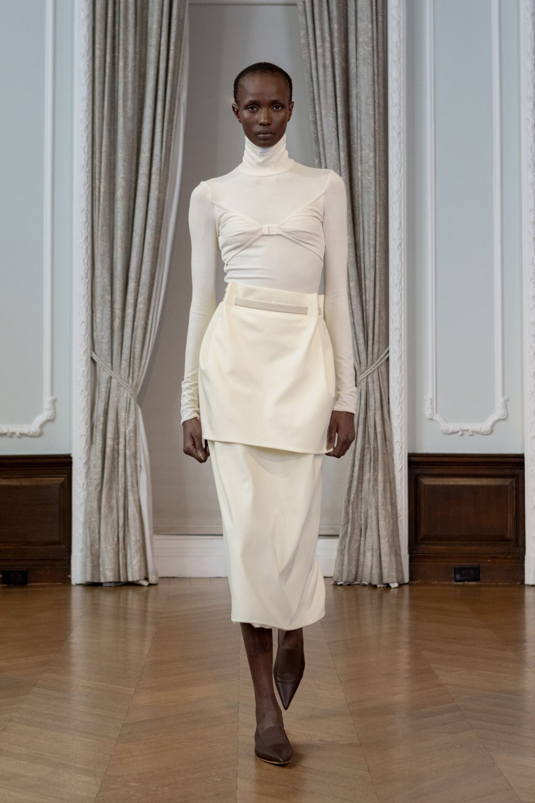 white fitted top beige skirt