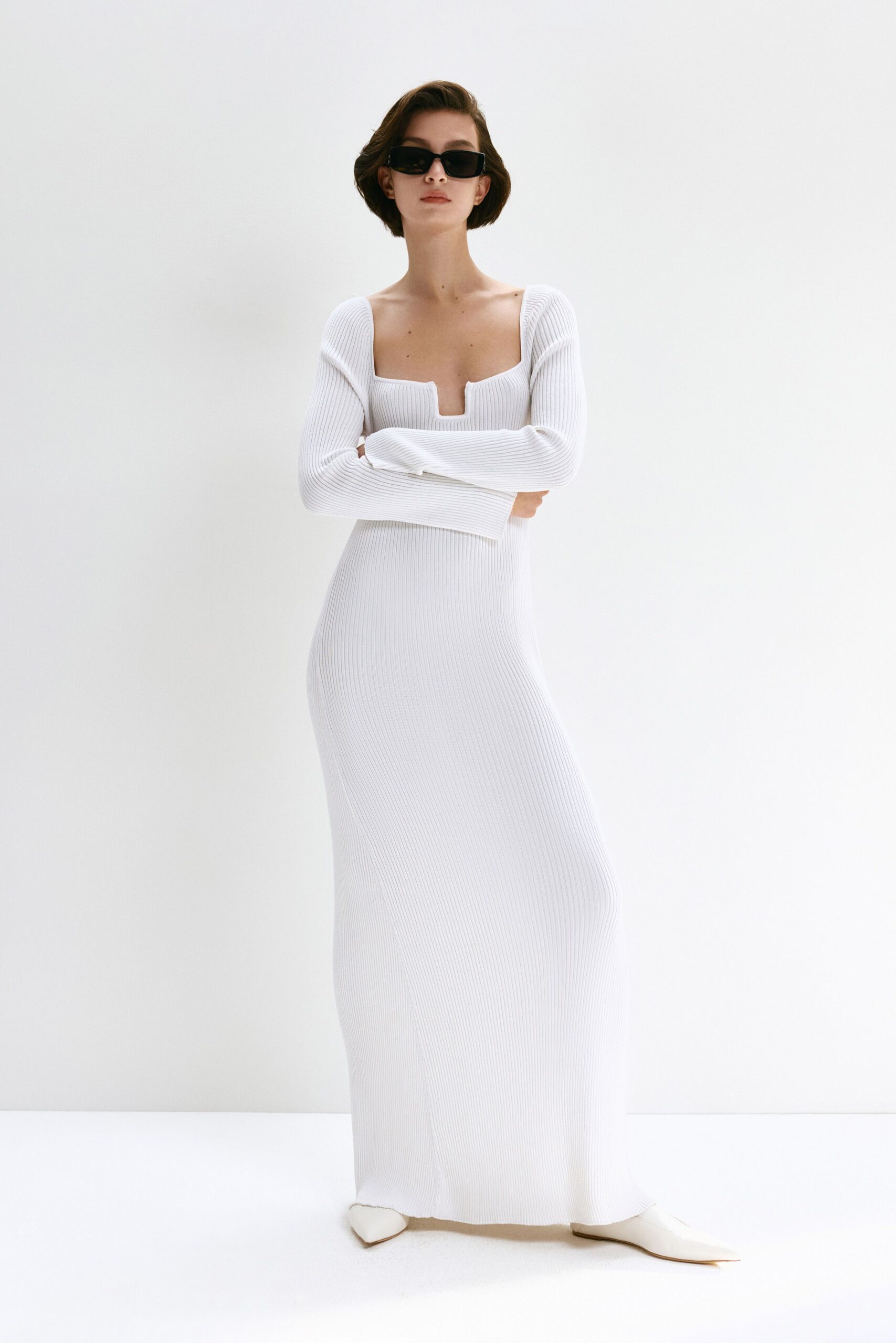 white fitted gown with long sleeves