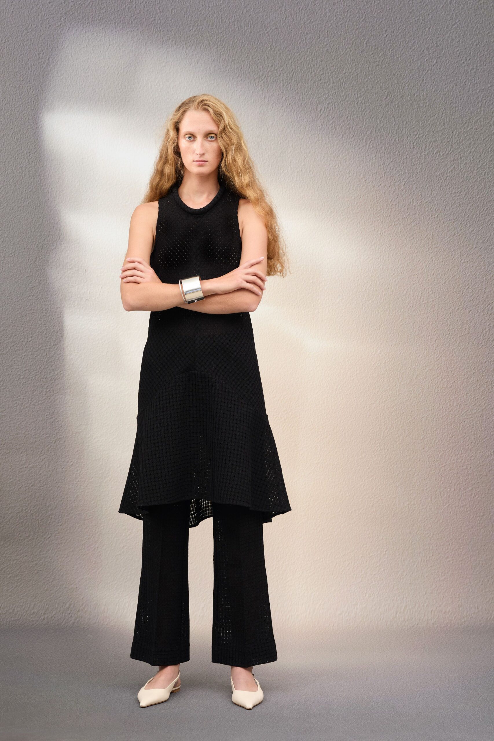 black mesh sleeveless high-neck fitted top