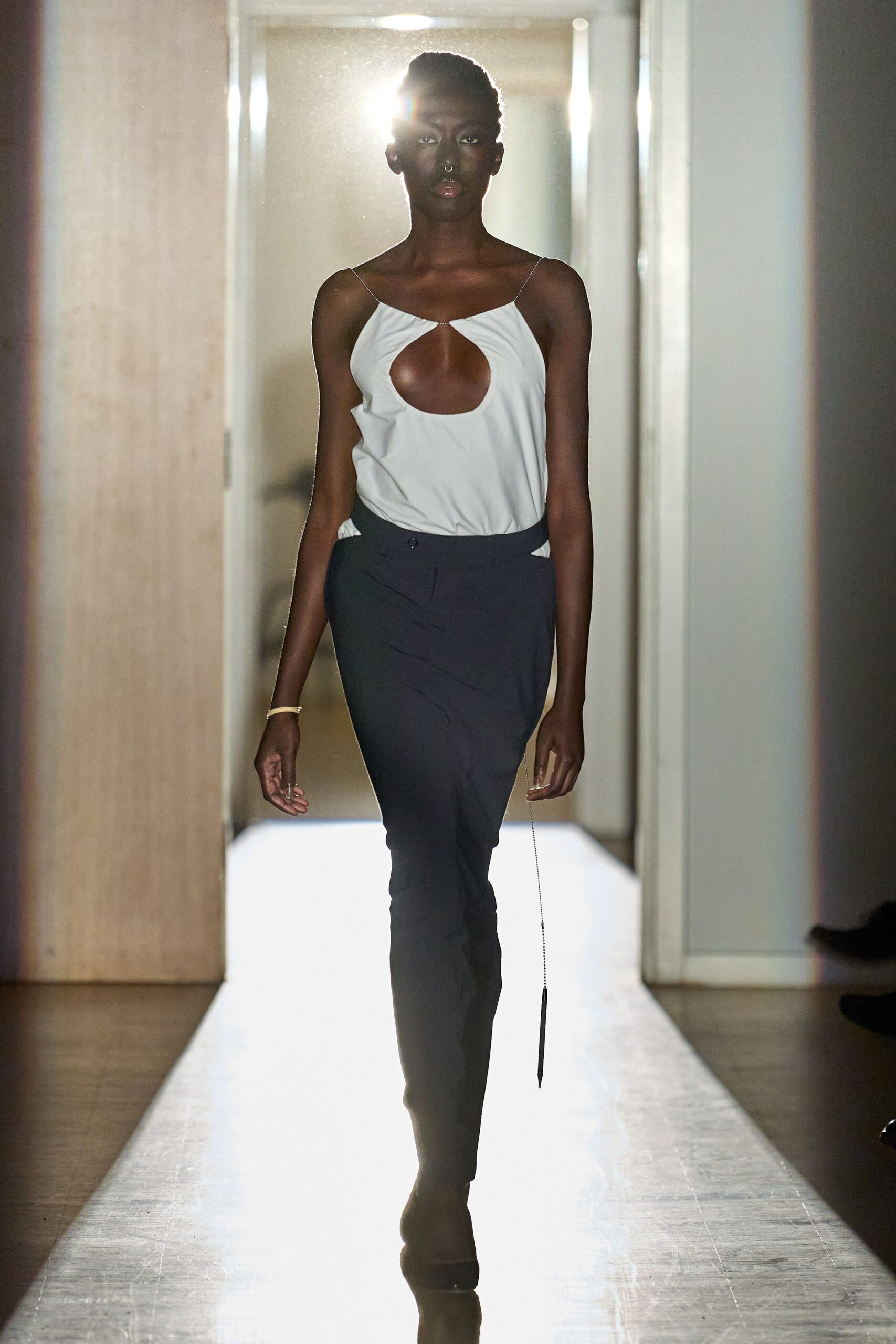 white cutout top with black pants
