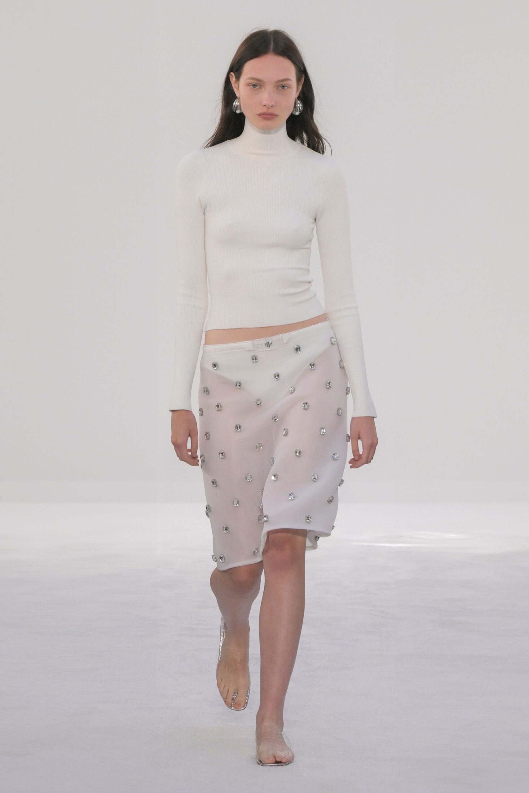 white fitted turtleneck top and midi skirt