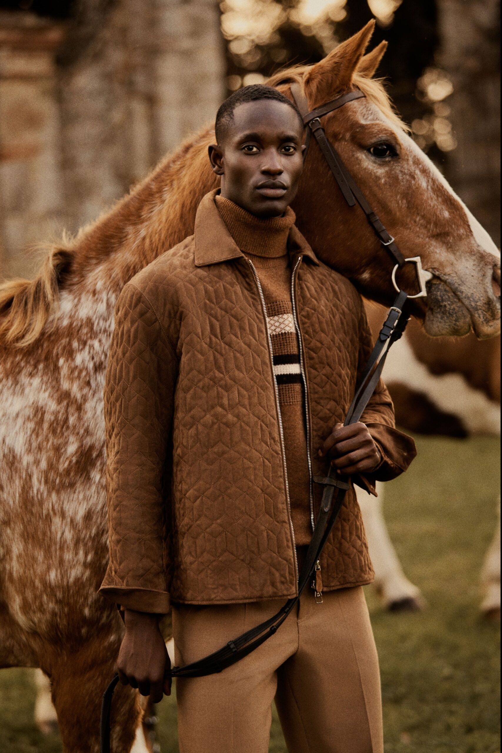 brown quilted jacket and beige pants