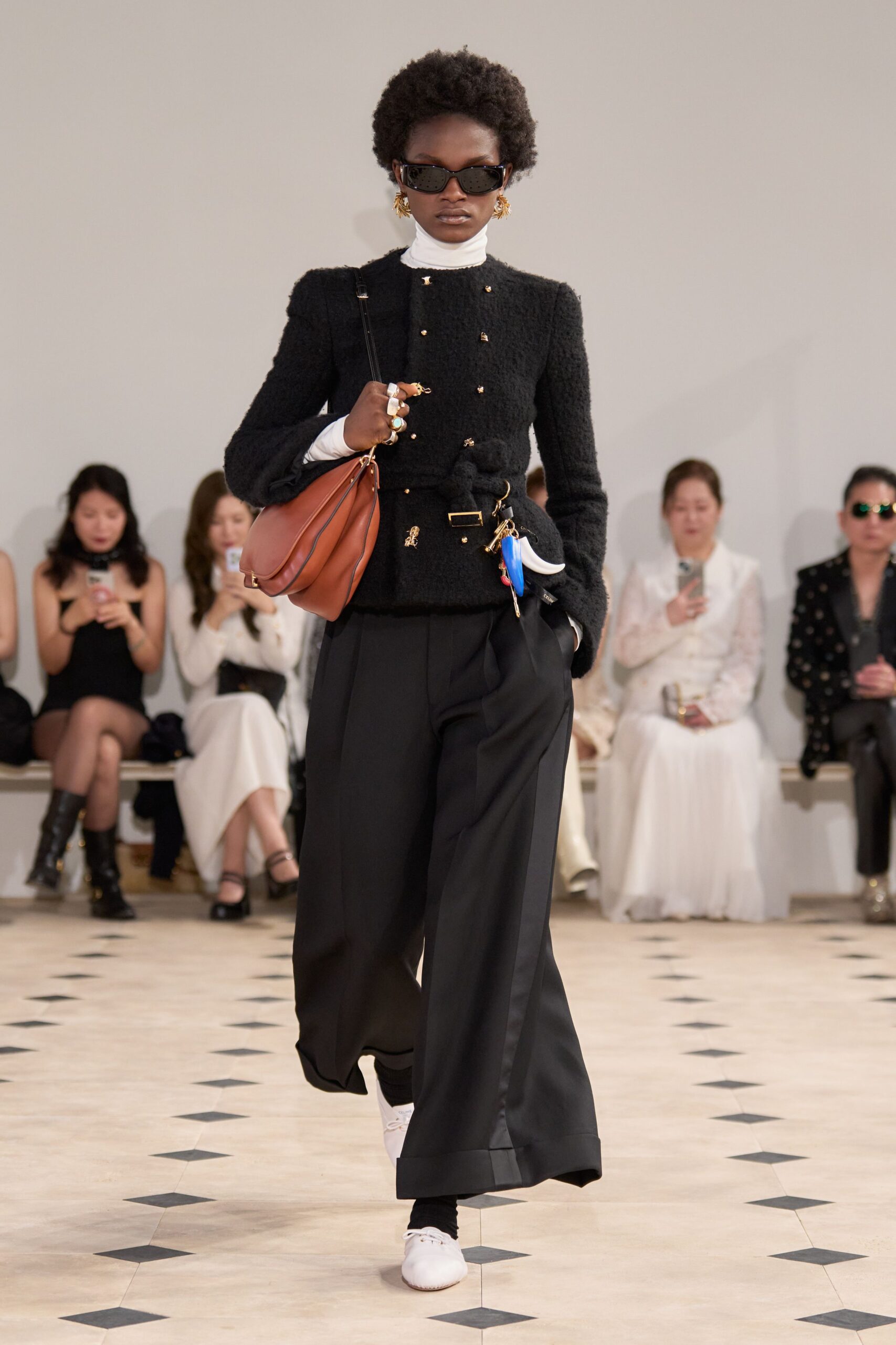 black textured jacket and wide pants