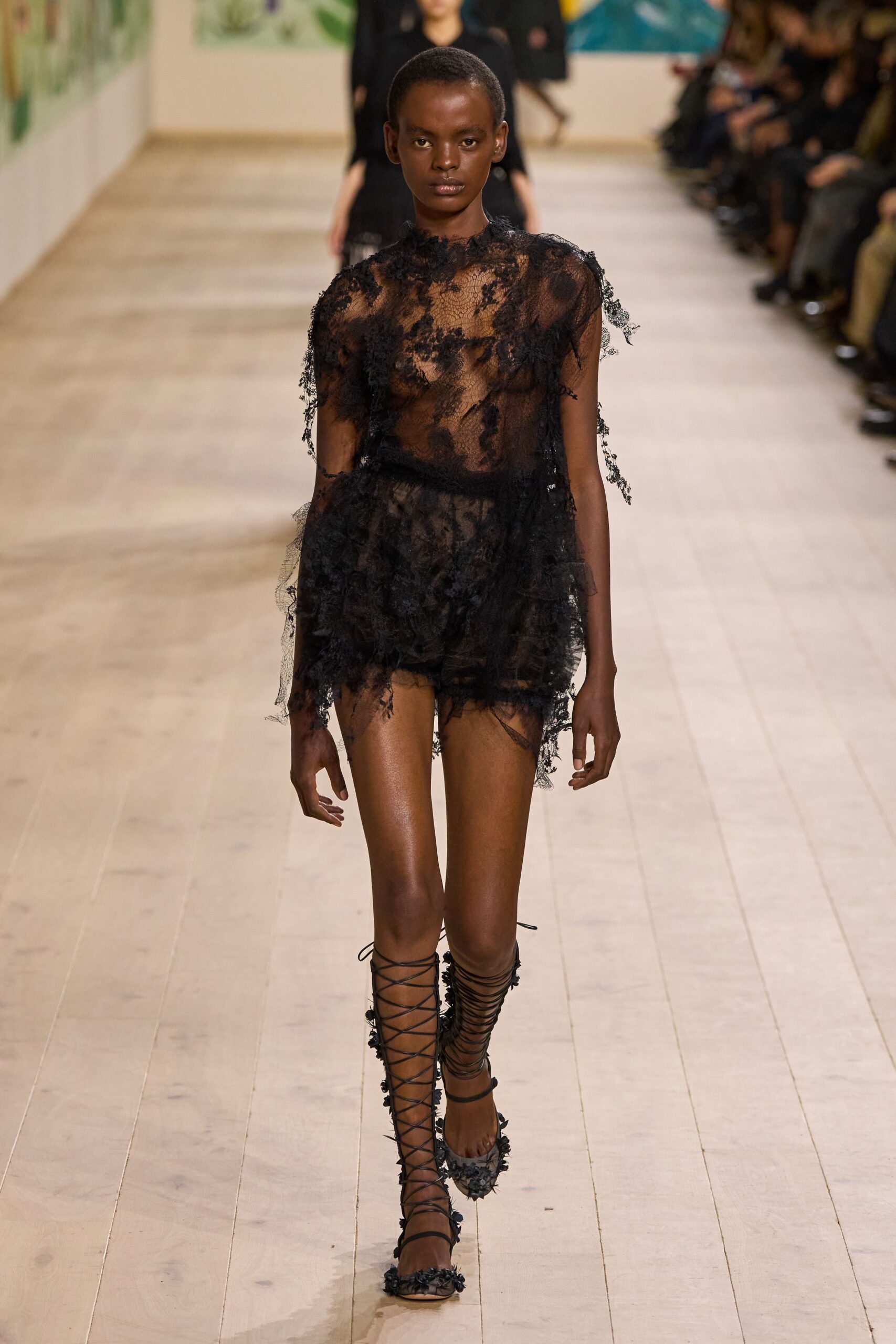 black lace mini dress with lace-up shoes