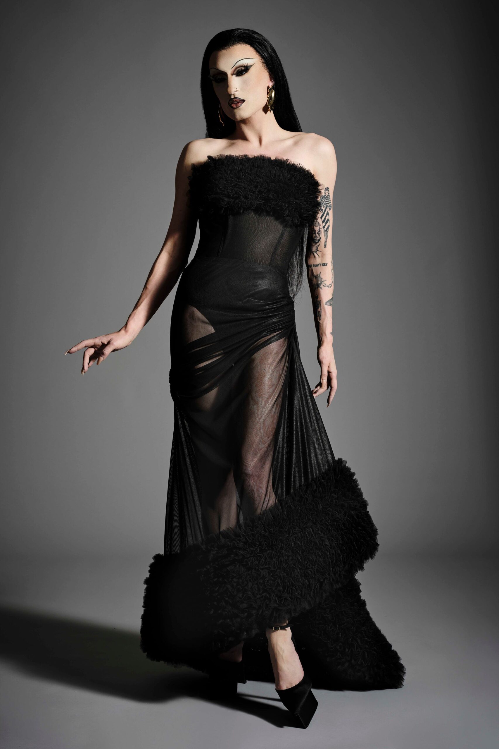 black mesh strapless fitted draped tiered sheer gown