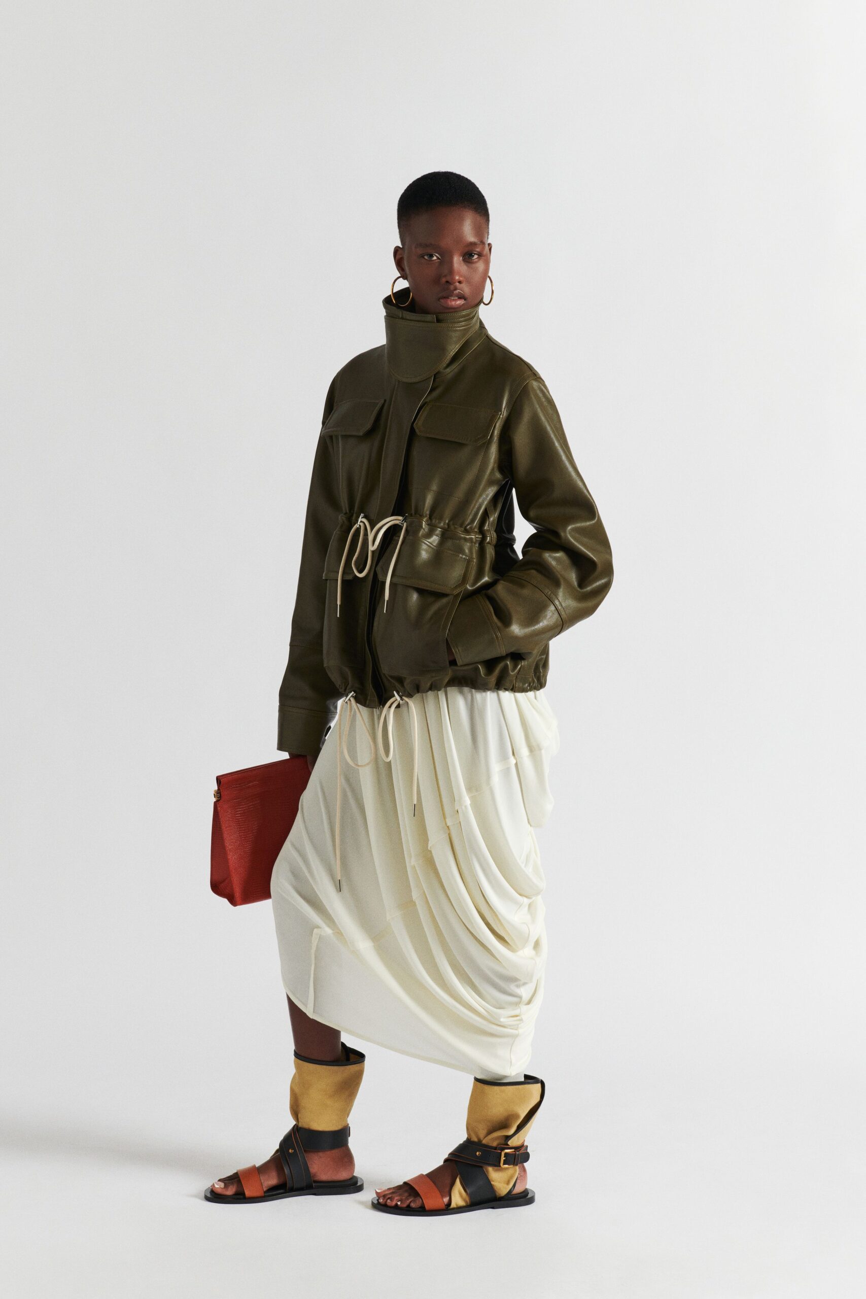 green leather jacket with white skirt